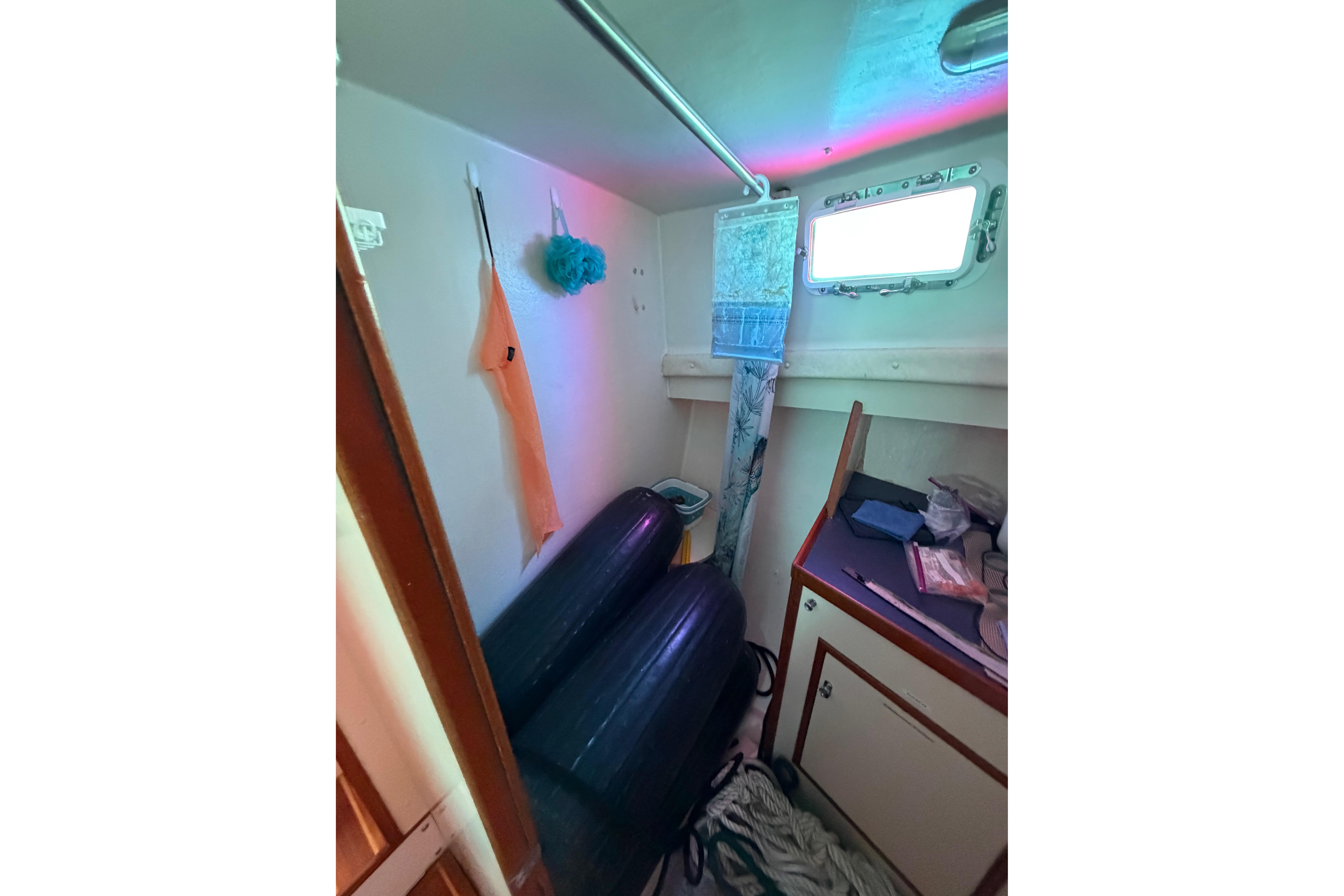 1997 Rosborough Trawler interior with storage, window, and hanging items.