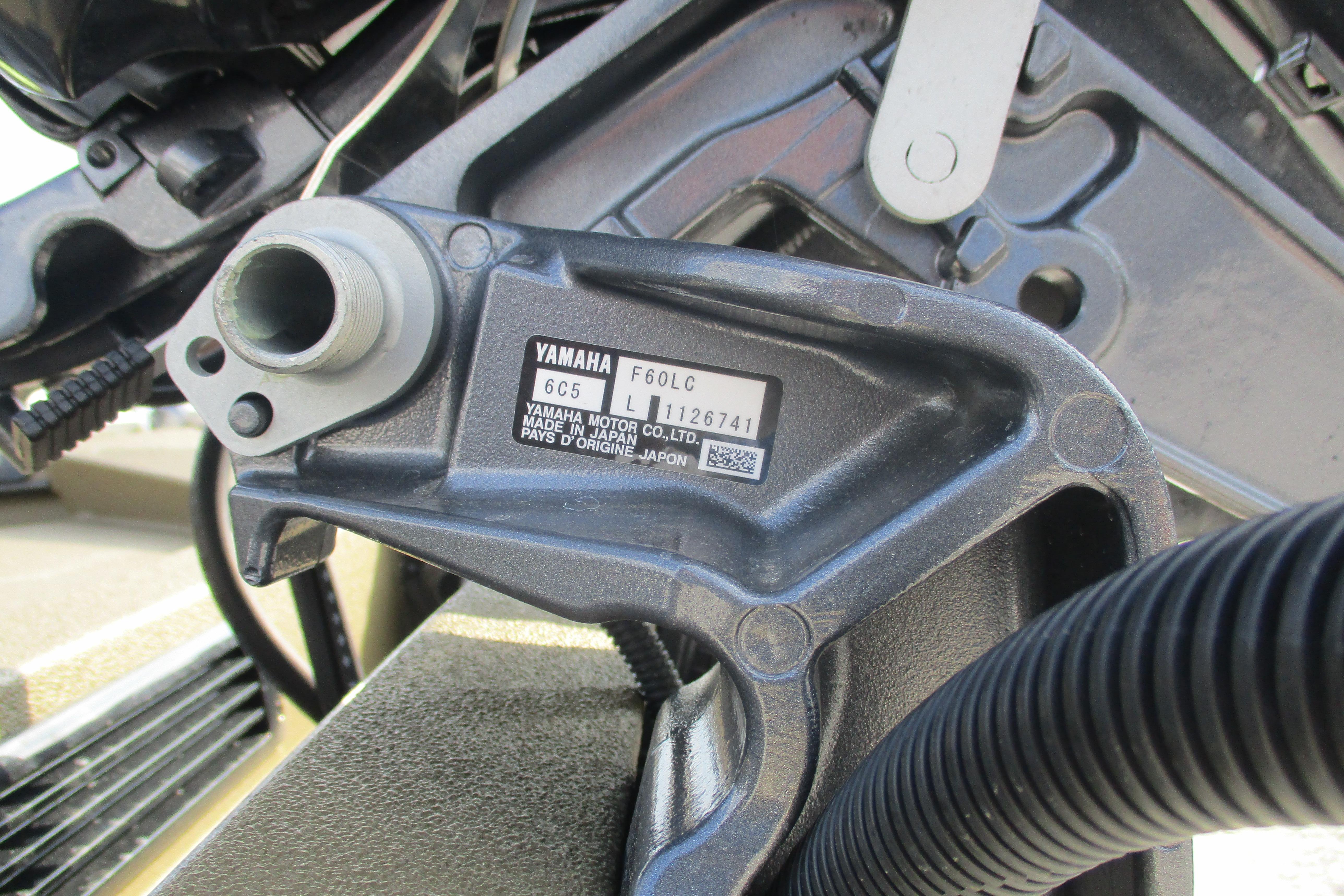 Close-up of Yamaha engine part on 2026 Avid 16 Commander boat.