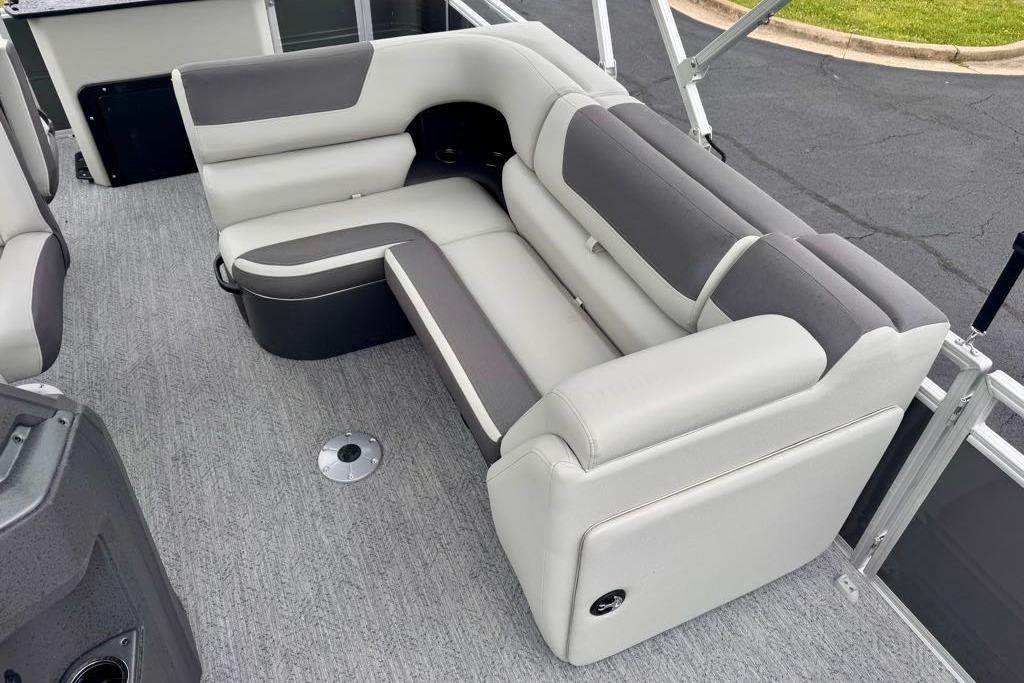 2026 Sun Tracker Fishin' Barge 20 DLX interior with gray and white seating.