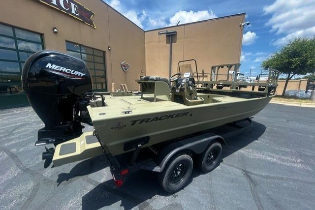 2026 Tracker Grizzly 2072 CC Sportsman boat with Mercury engine on trailer.