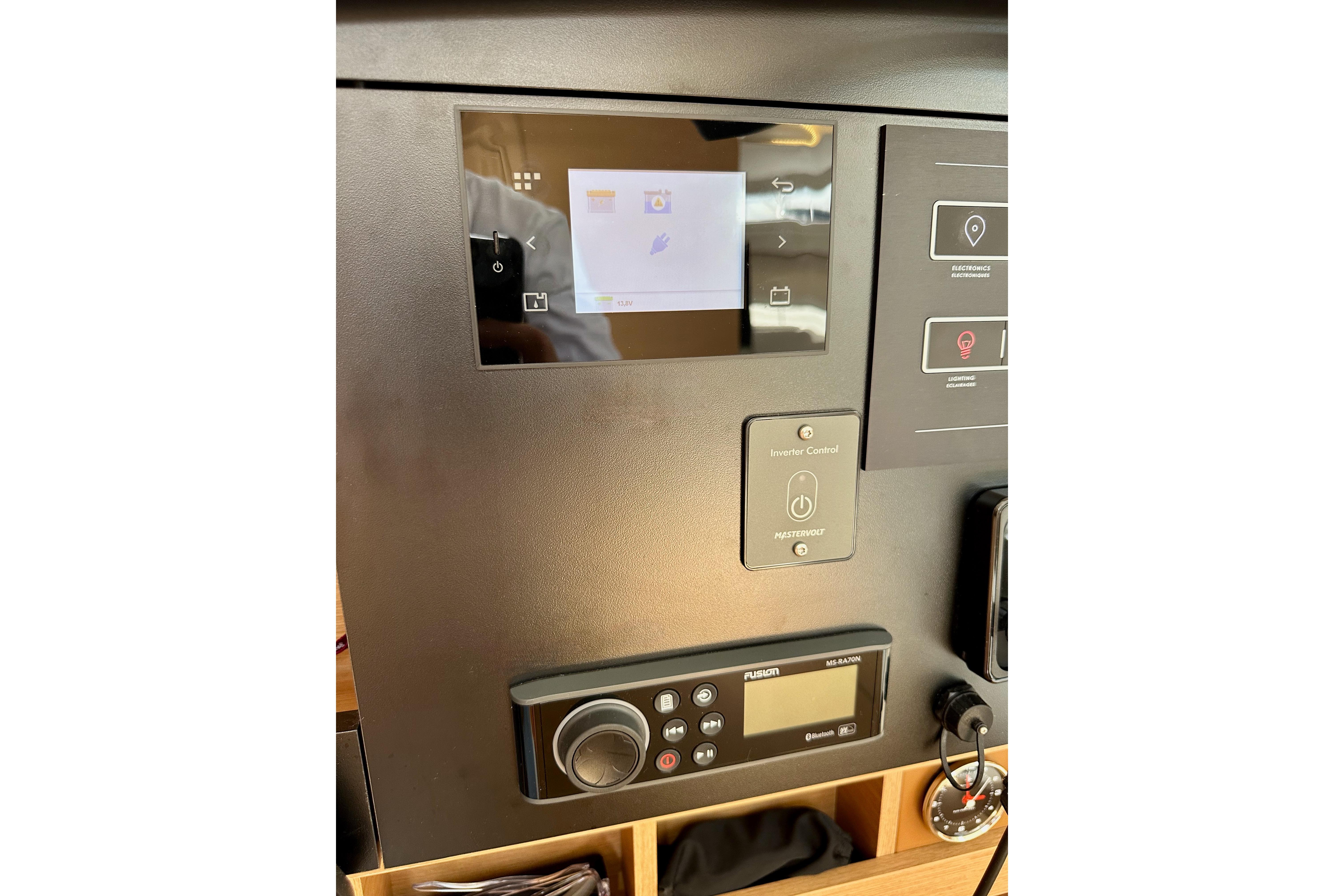 Control panel of 2024 Jeanneau Sun Odyssey 410 yacht with touchscreen and audio system.