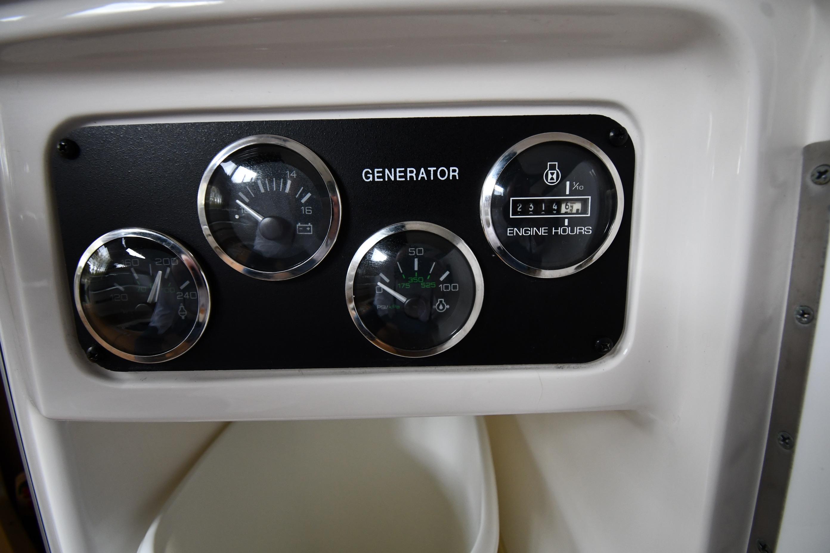 Control panel of a 2001 Sea Ray 540 Sundancer showing generator gauges.