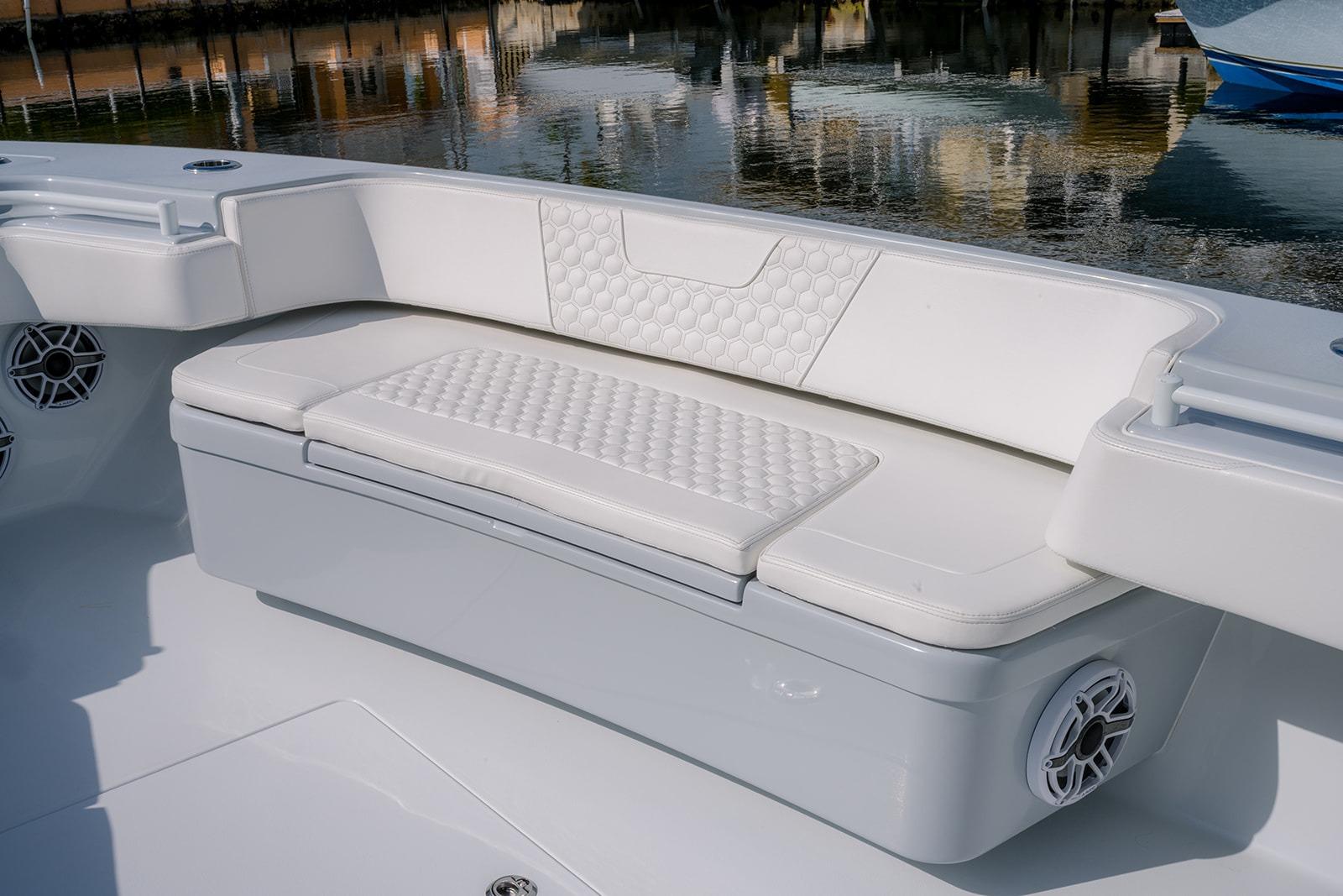 2024 Contender 44 ST boat with white cushioned seating and sleek design.