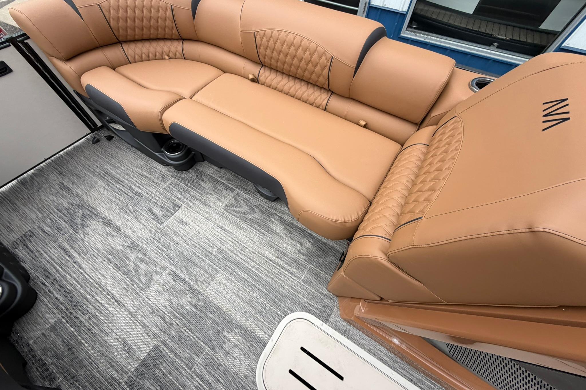 Luxurious tan seating in 2026 Avalon Catalina Quad Lounge boat interior.