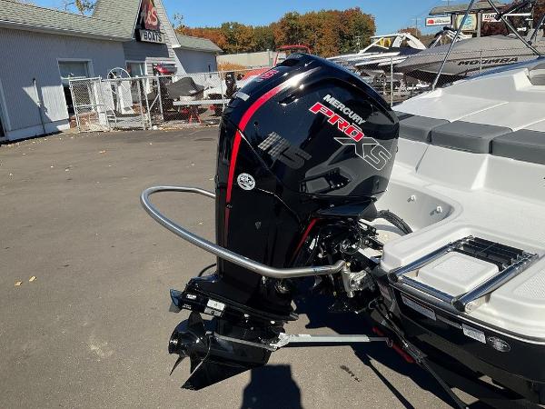 2025 Tahoe T18 boat with Mercury Pro XS outboard motor in a boatyard.