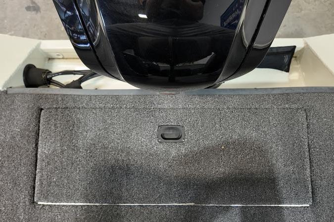 2024 Lowe Stinger 188 boat interior with carpeted deck and motor.