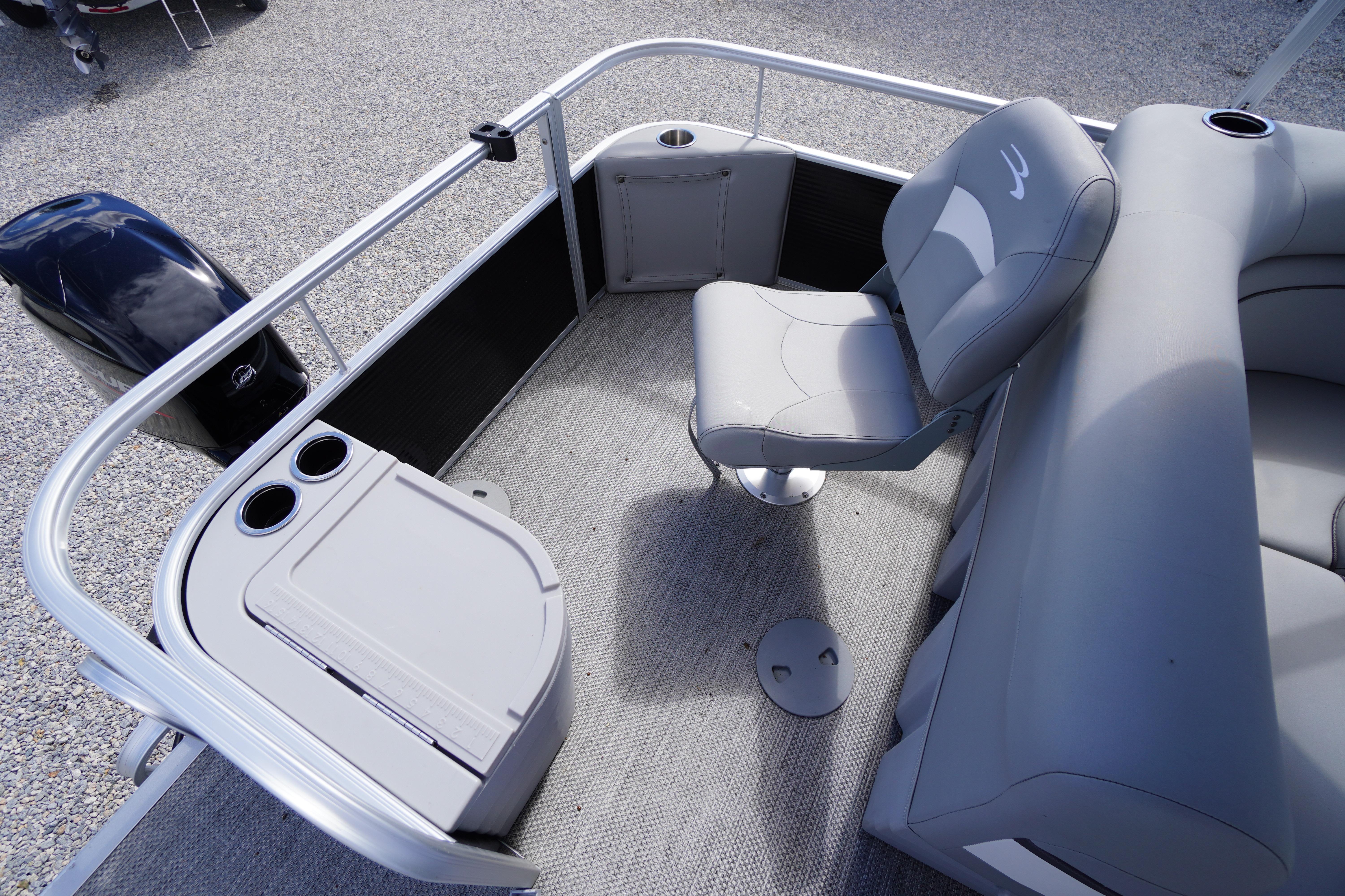 2023 Bennington S 18 Fishing boat interior with seating and storage compartments.