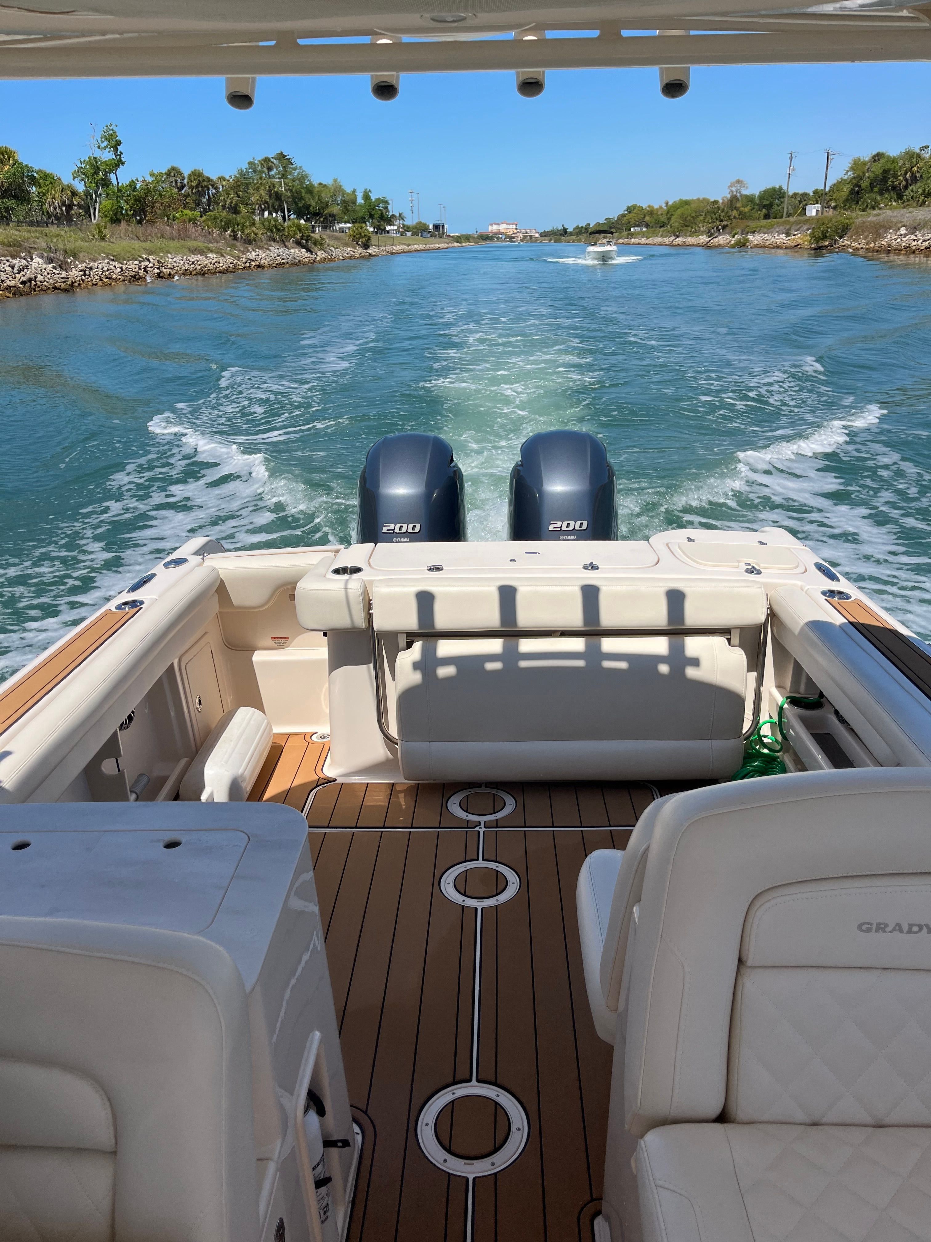Grady-White Freedom 275 boat, 2022 model, cruising on calm waters.
