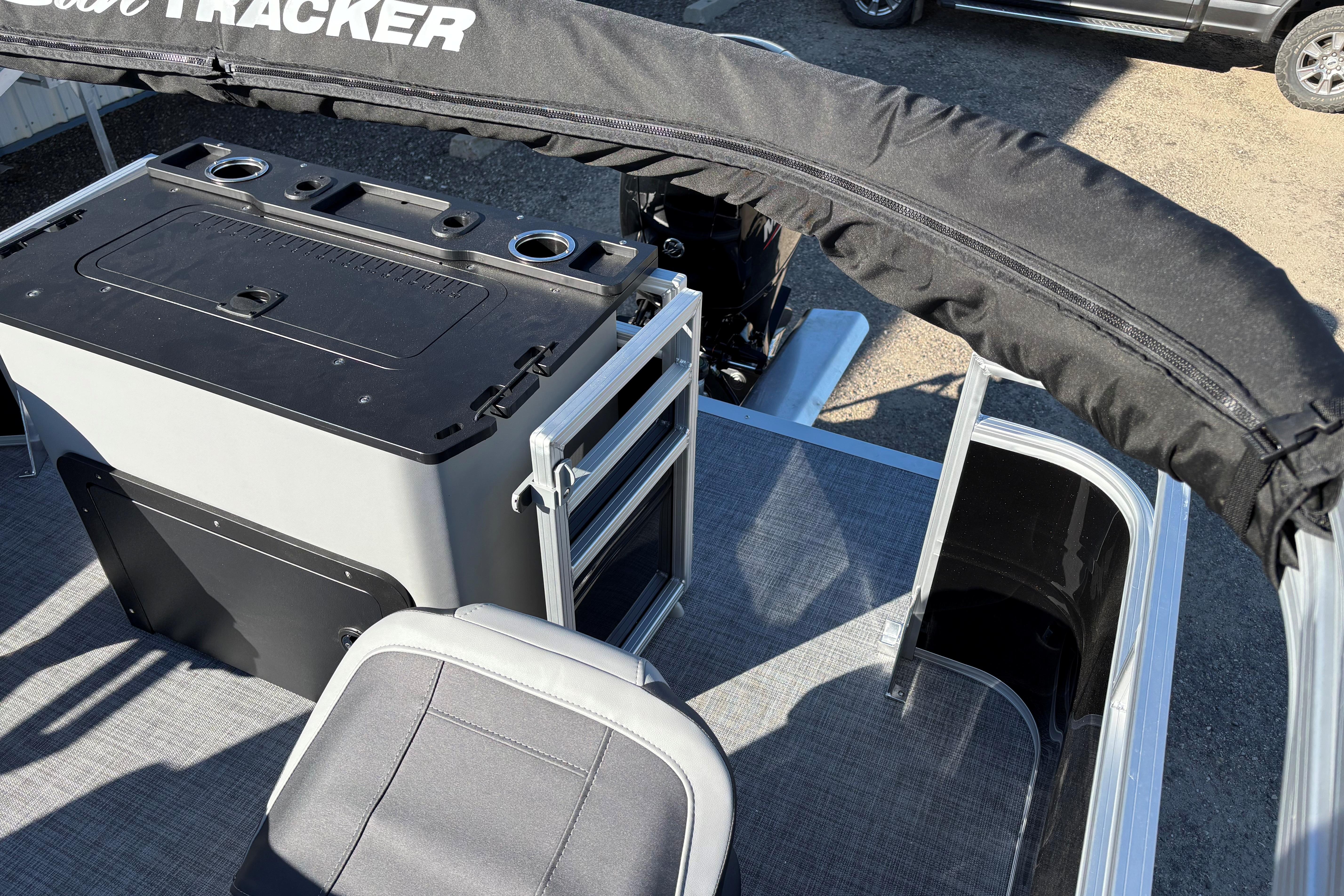 2026 Sun Tracker SportFish 22 XP3 boat interior with seating and storage compartments.