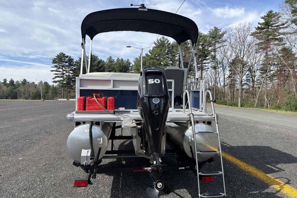 2026 Sun Tracker Bass Buggy 16 XL Select pontoon boat with 50 HP Mercury engine.