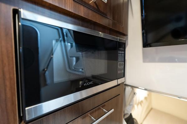 Built-in microwave in 2016 Regal 28 Express boat interior kitchen area.