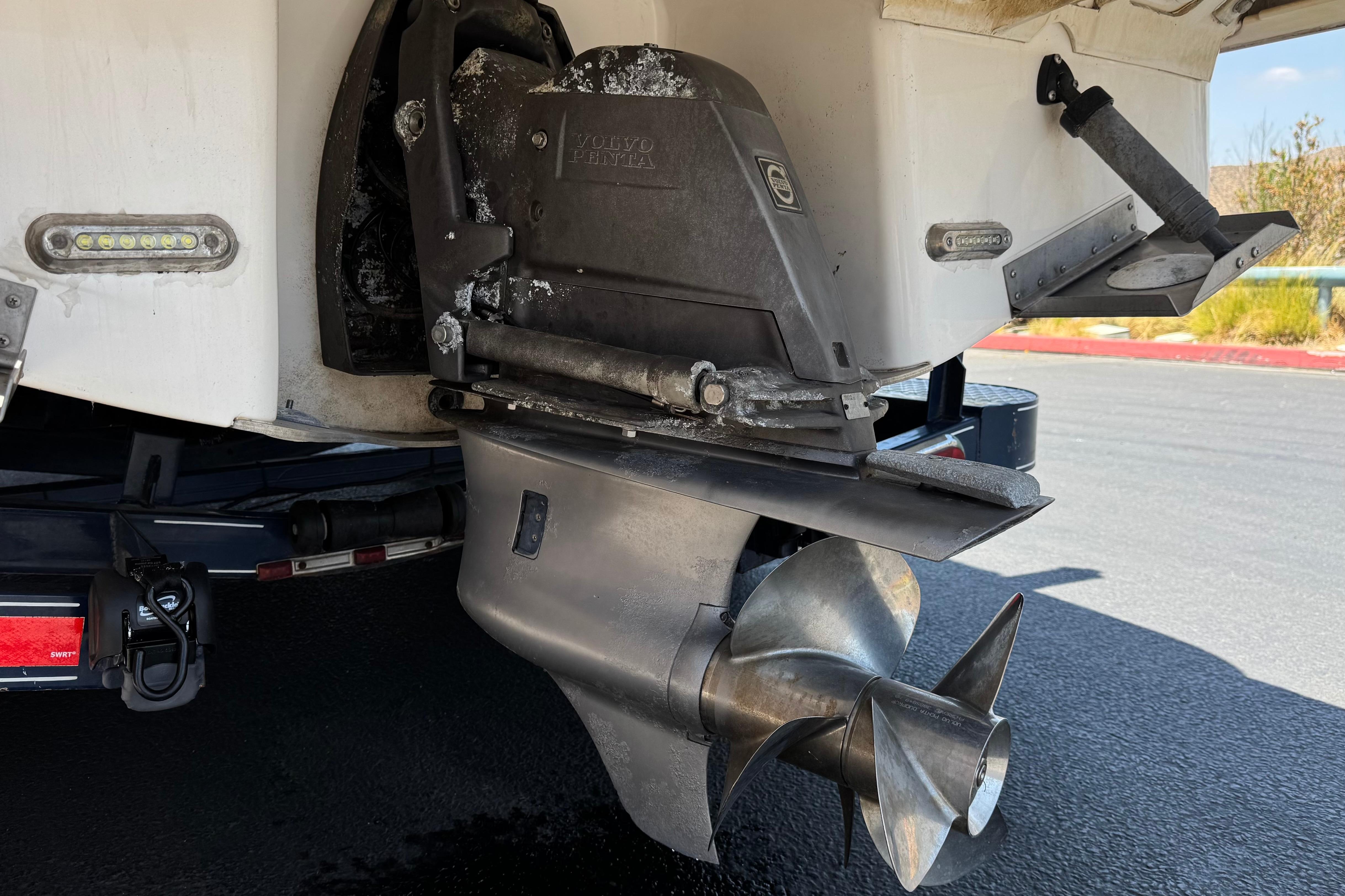 2013 Regal 28 Express boat with Volvo Penta outdrive, detailed view of propeller and stern.