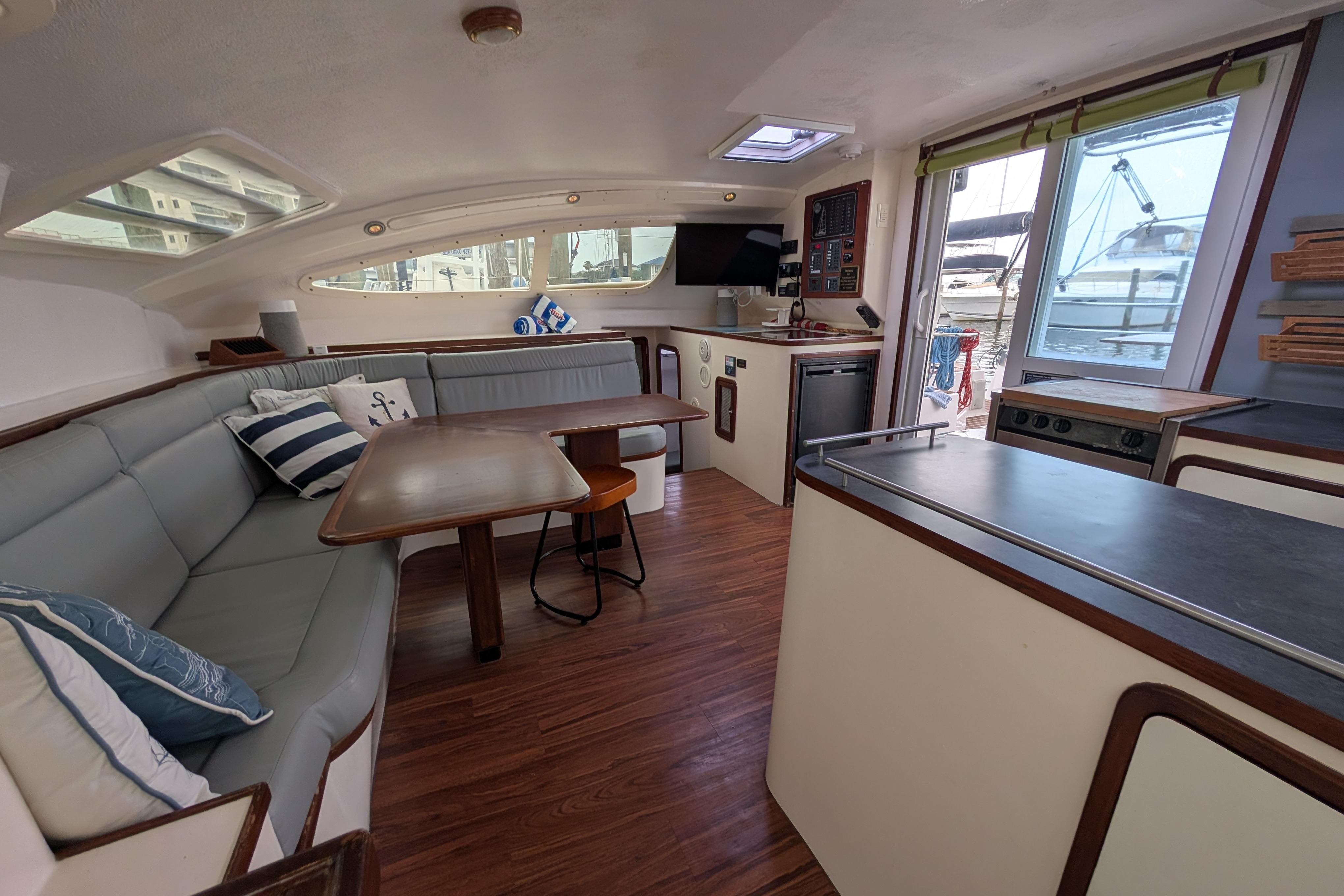 Interior of 1999 Island Spirit 37 yacht with cozy seating and modern amenities.