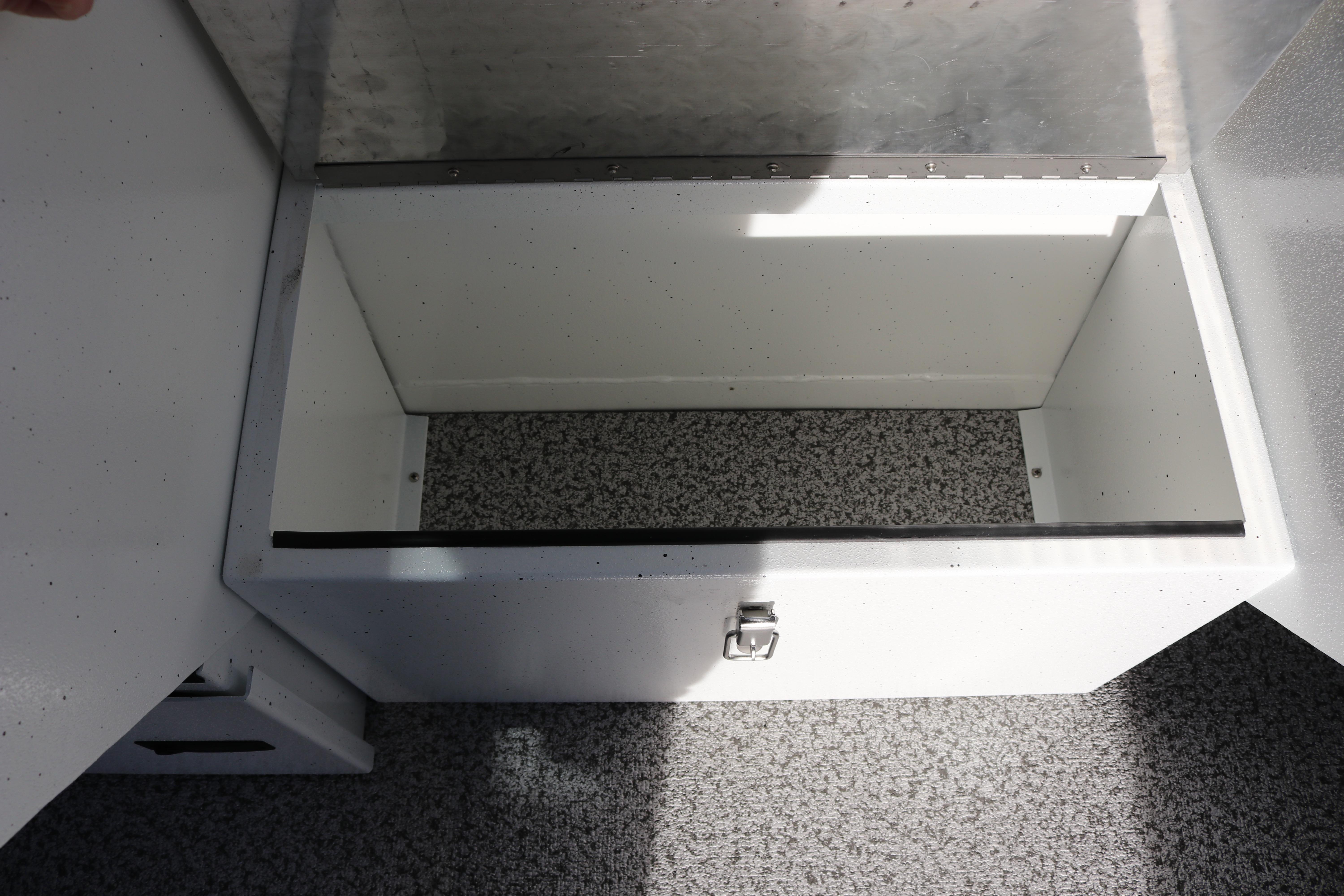 Storage compartment in 2026 Alumaweld Intruder Outboard 22 boat, featuring a secure latch.