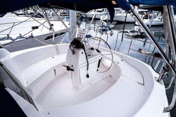 Cockpit of a 2001 Hunter 340 sailboat docked at a marina.