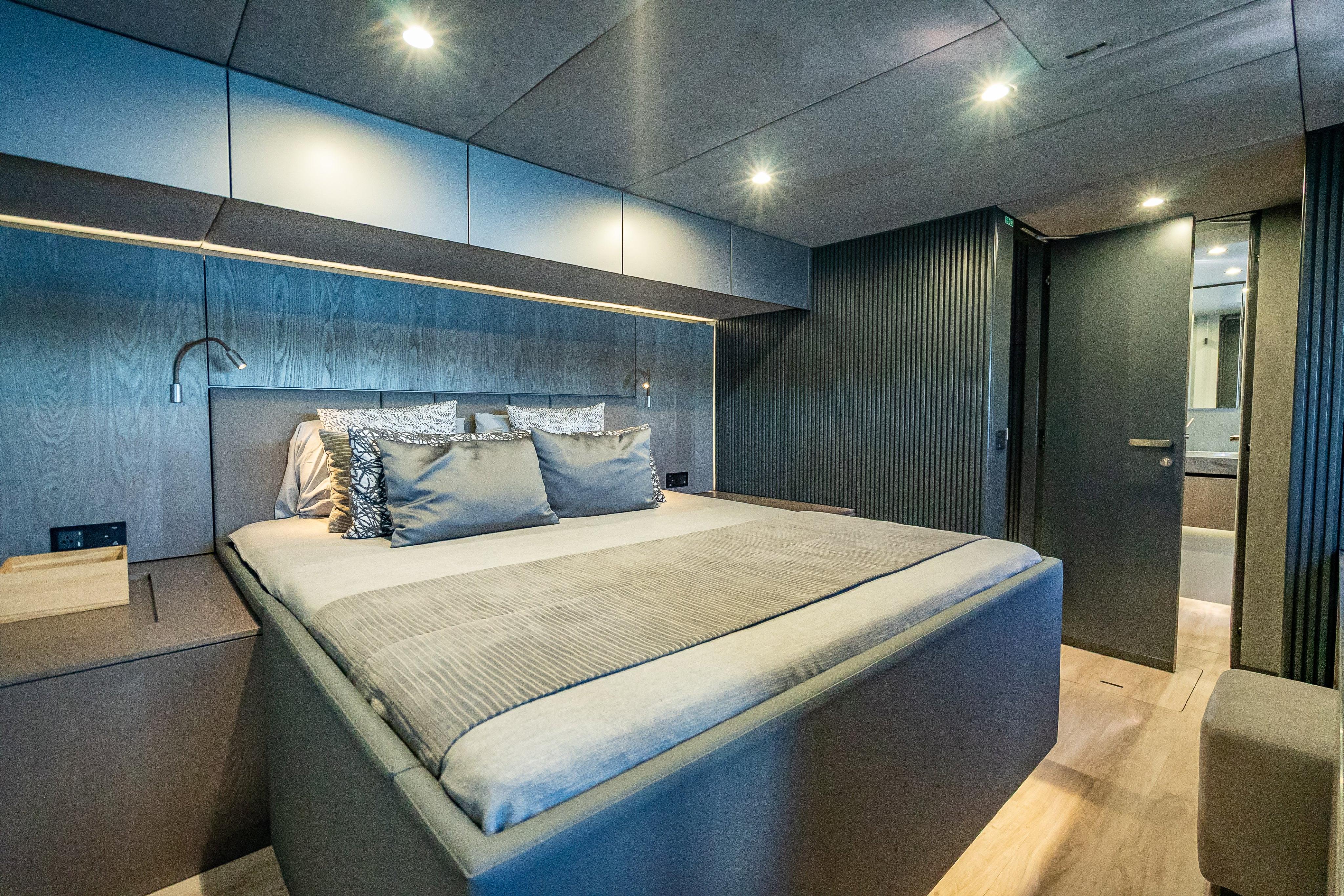 Luxurious bedroom interior of 2026 Sunreef 60 Power yacht with modern design.