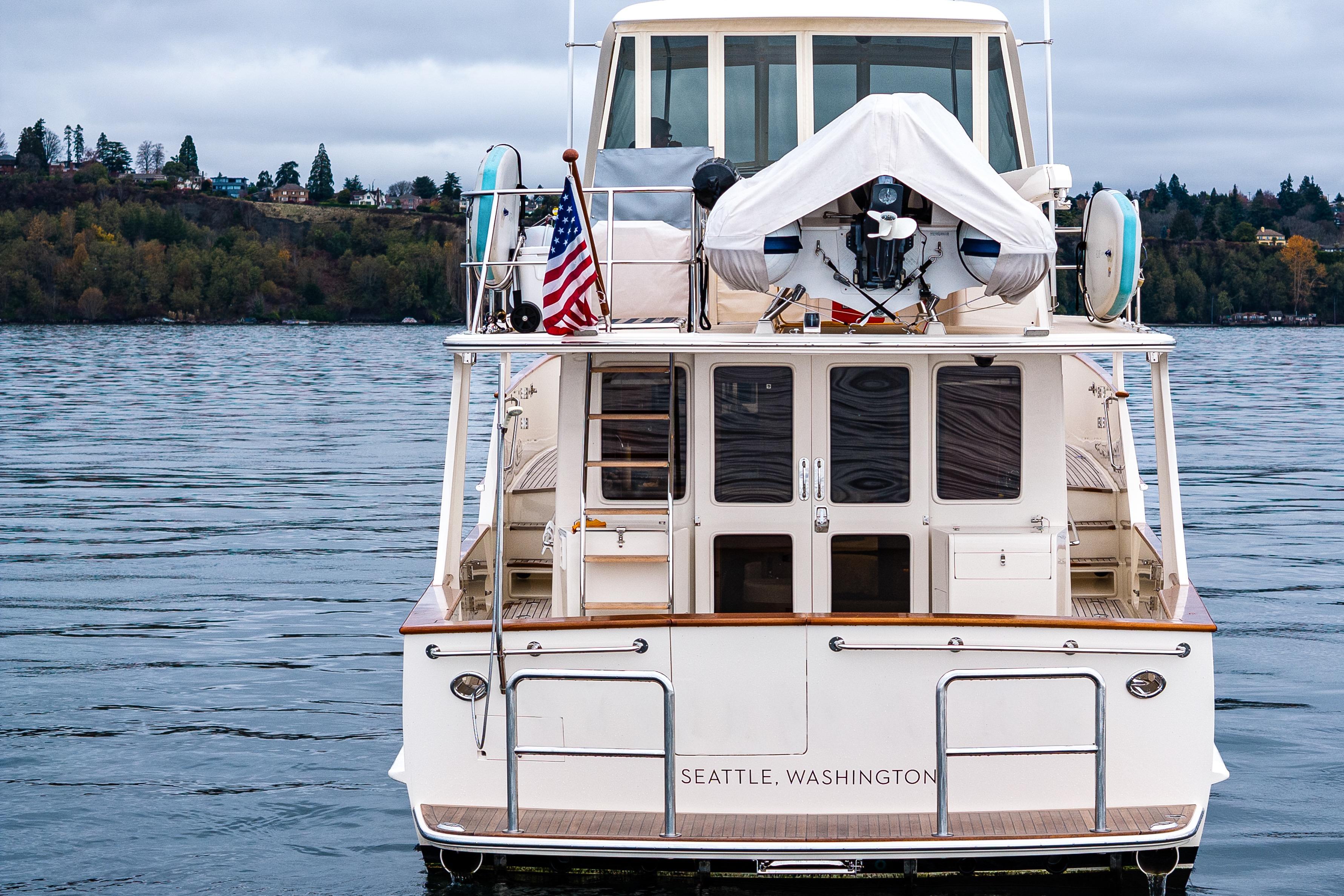 2026 Fleming 55 Pilothouse yacht on water, Seattle, Washington, rear view.