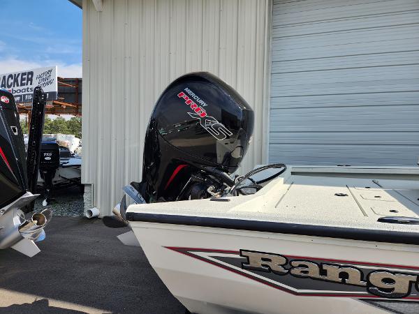 2025 Ranger RB200 boat with Mercury Pro XS engine, parked near a garage.