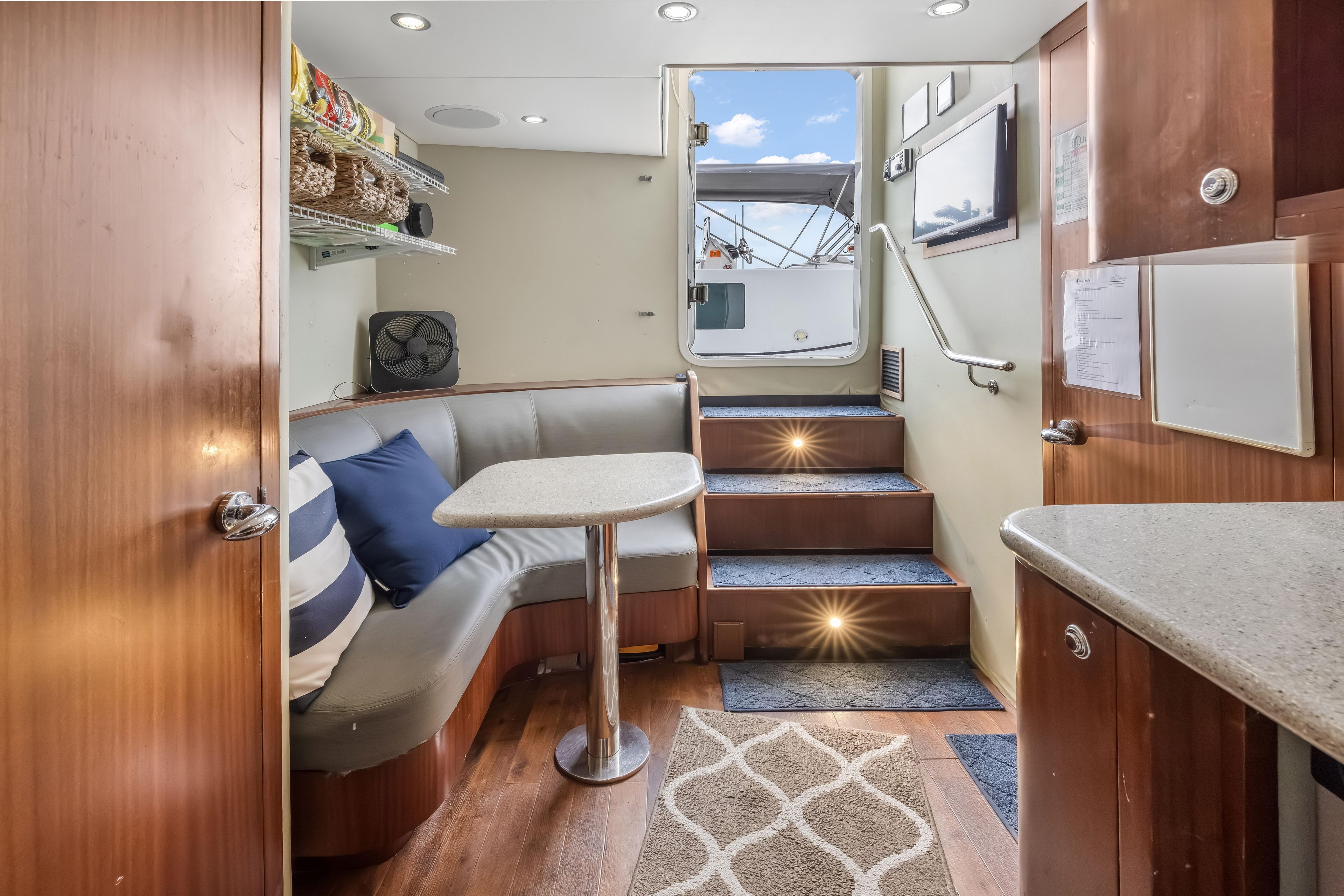 Luxurious interior of 2012 Cheoy Lee 84 Bravo yacht with cozy seating and elegant decor.