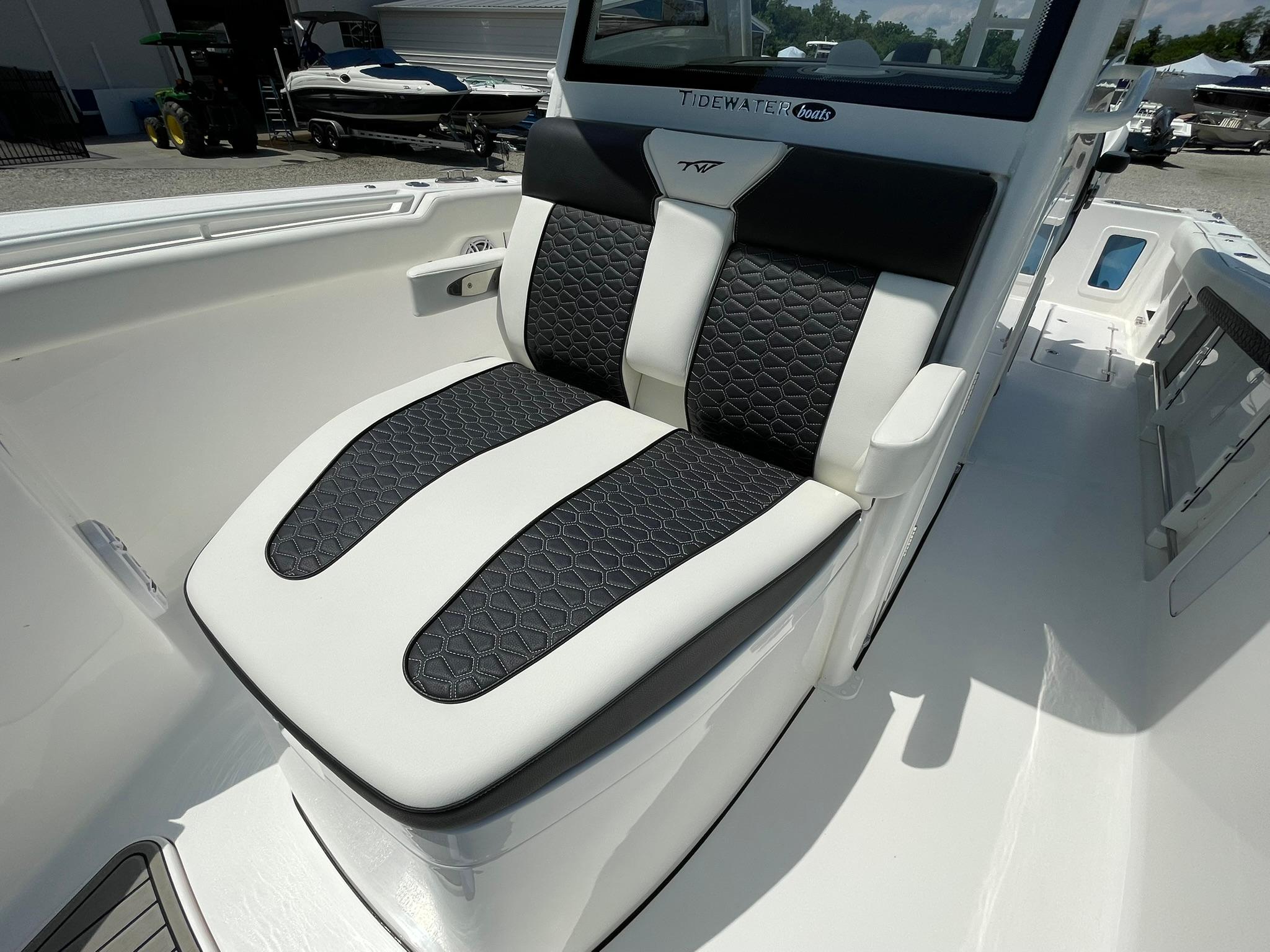 2026 Tidewater 302 CC Adventure boat seat with black and white upholstery.