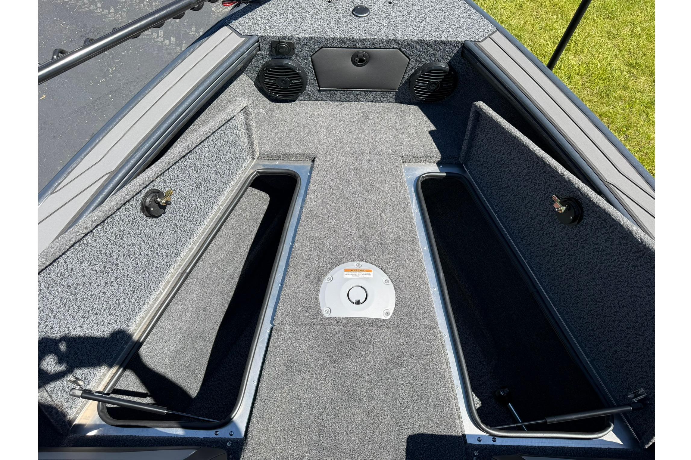 Interior view of 2027 Lund 1775 Crossover XS boat, featuring open storage compartments.