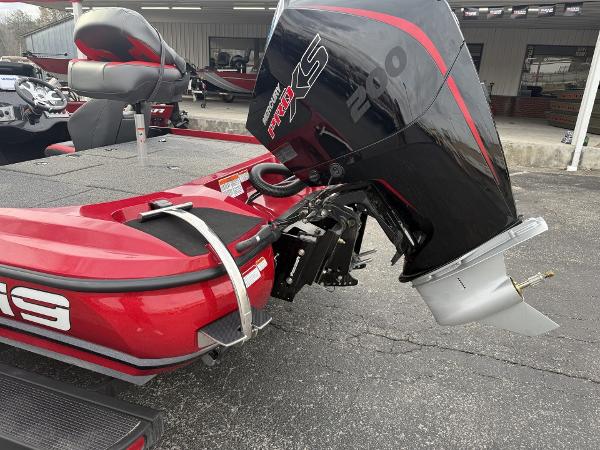 2025 Nitro Z19 boat with powerful outboard motor, parked on pavement.