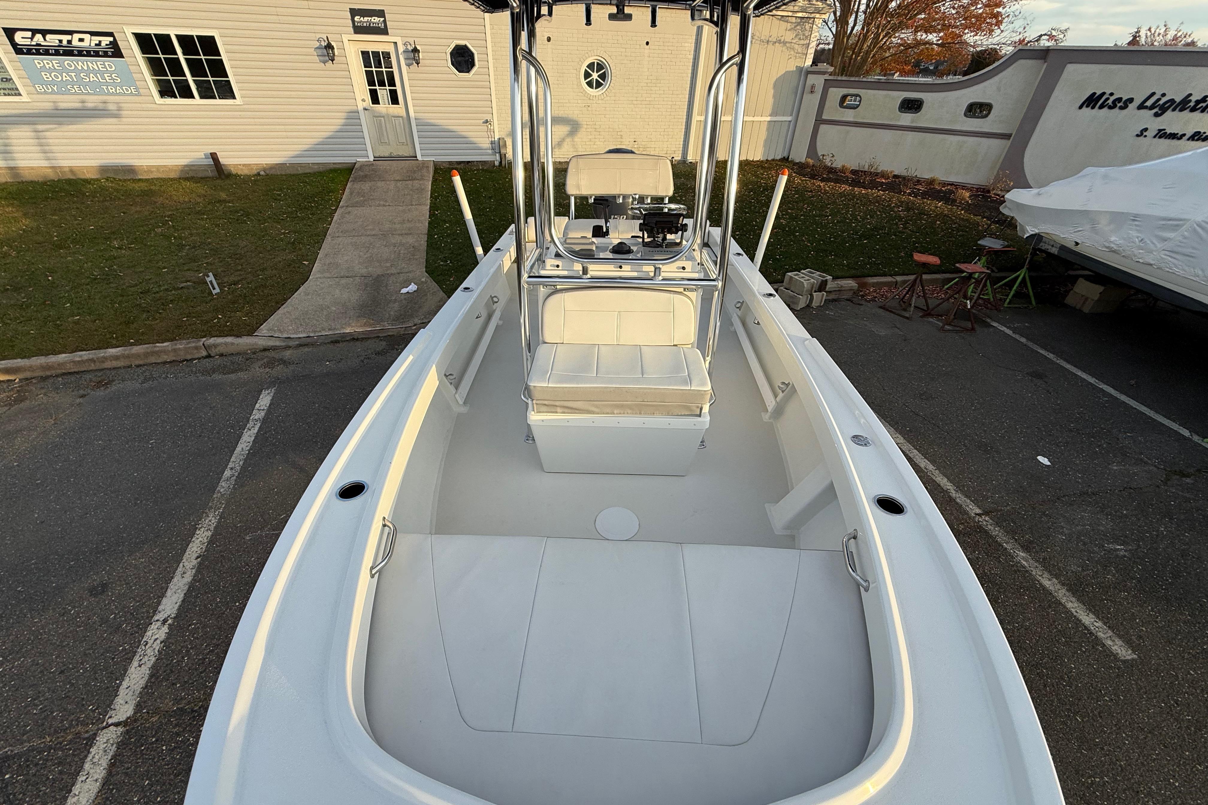 2024 Parker 1801 Center Console boat at dealership, showcasing spacious deck and seating.