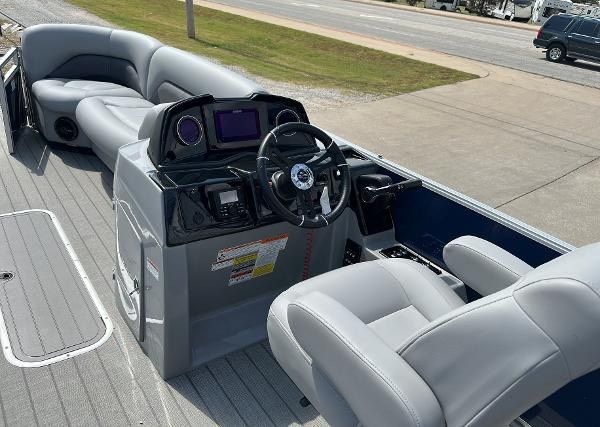 Interior of 2024 Landau ATLANTIS 230C with gray seating and helm console.