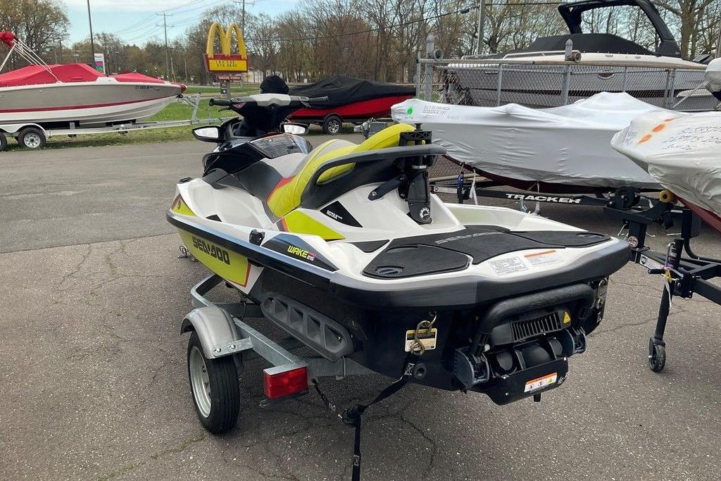 2014 Sea-Doo Wake Pro 215 jet ski on trailer, parked outdoors.