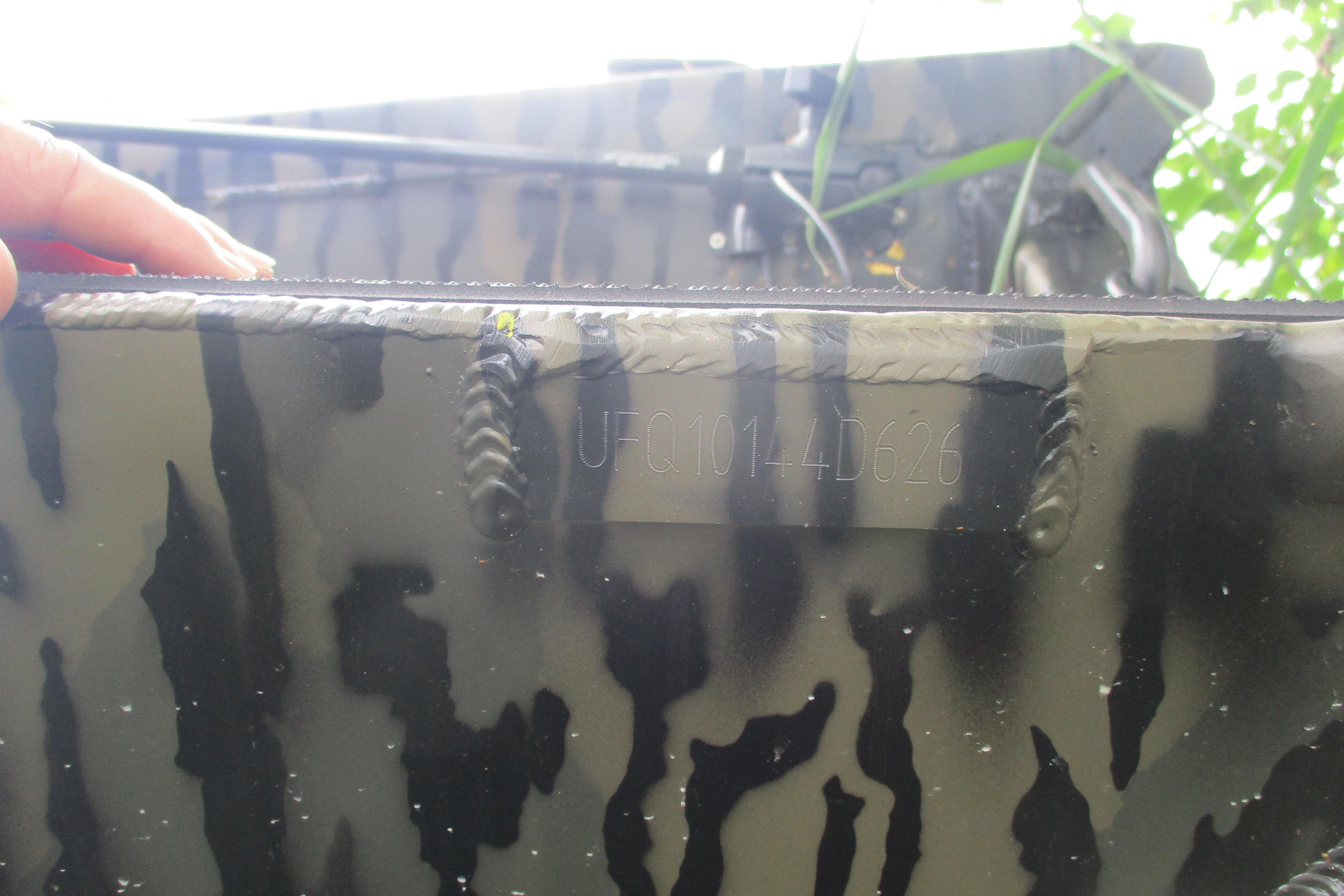 Camouflage-patterned Gator Tail 1854 Extreme boat, 2026 model, with visible serial number.
