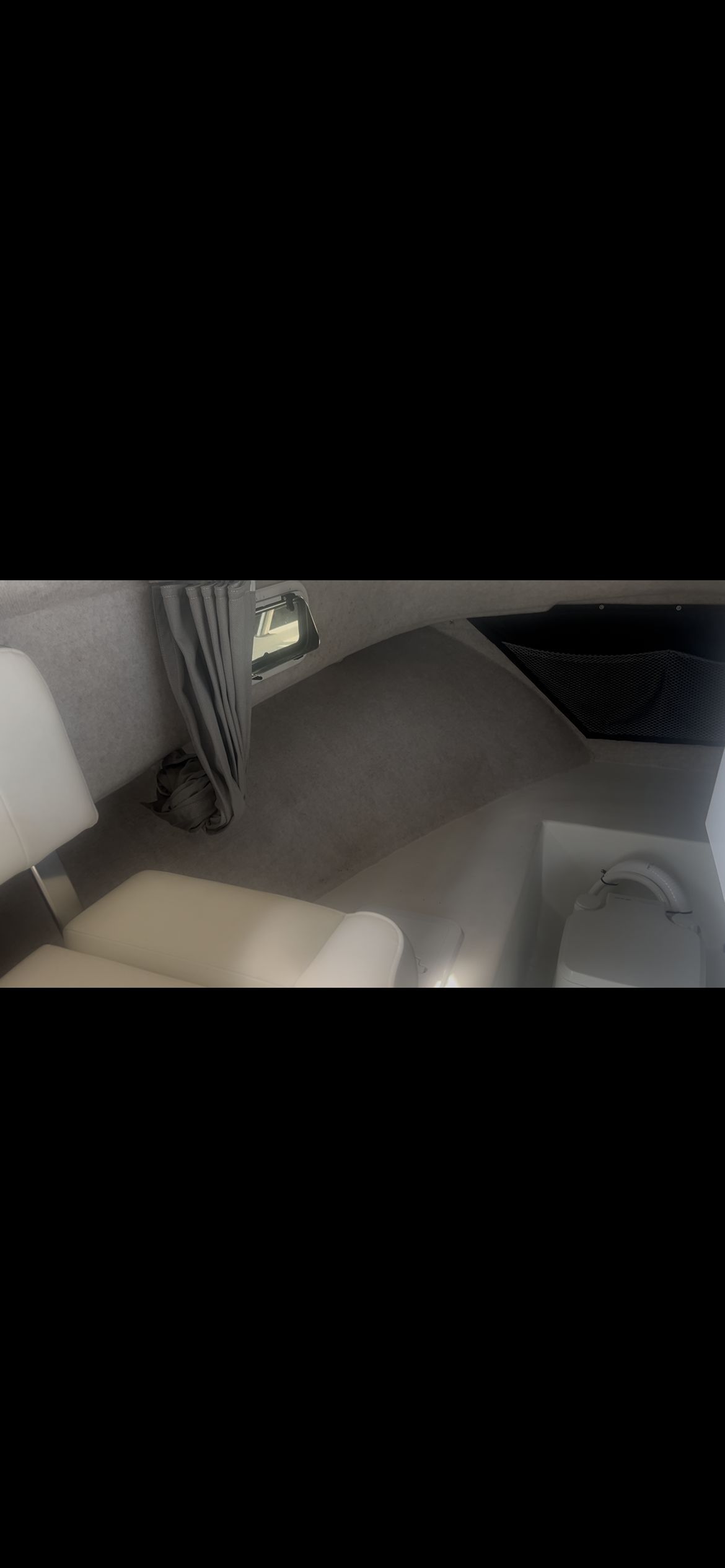 Interior of a Parker 2320 Sport Cabin with seating and a window.