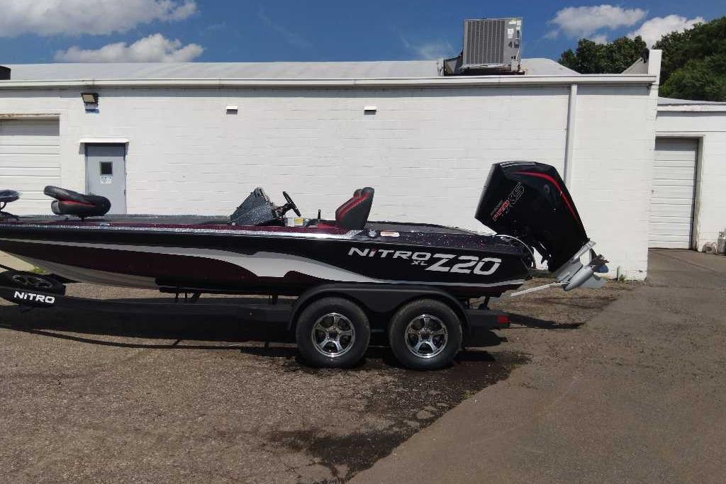 2026 Nitro Z20 XL Pro boat on trailer, parked outside a white building.