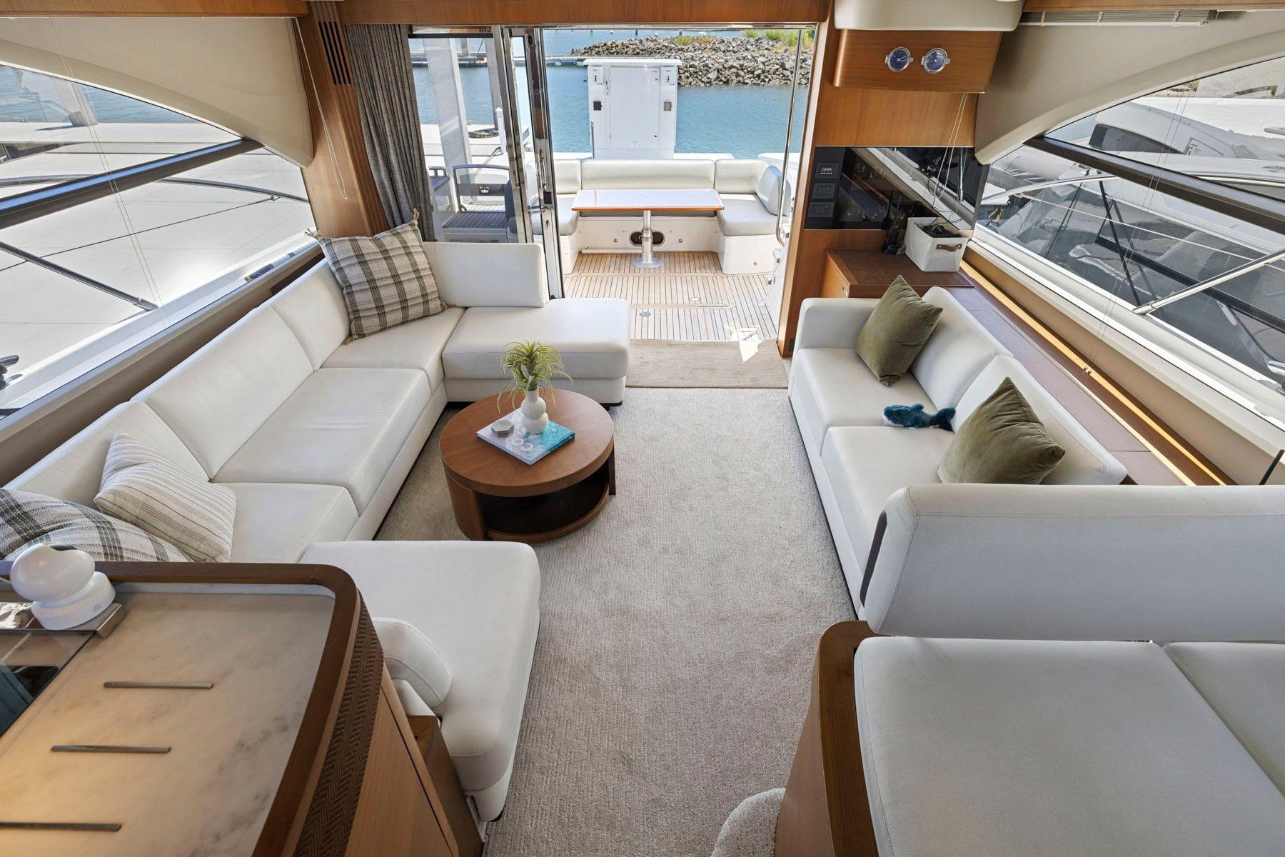 Luxurious interior of 2015 Princess 60 Flybridge Motor Yacht with elegant seating and decor.