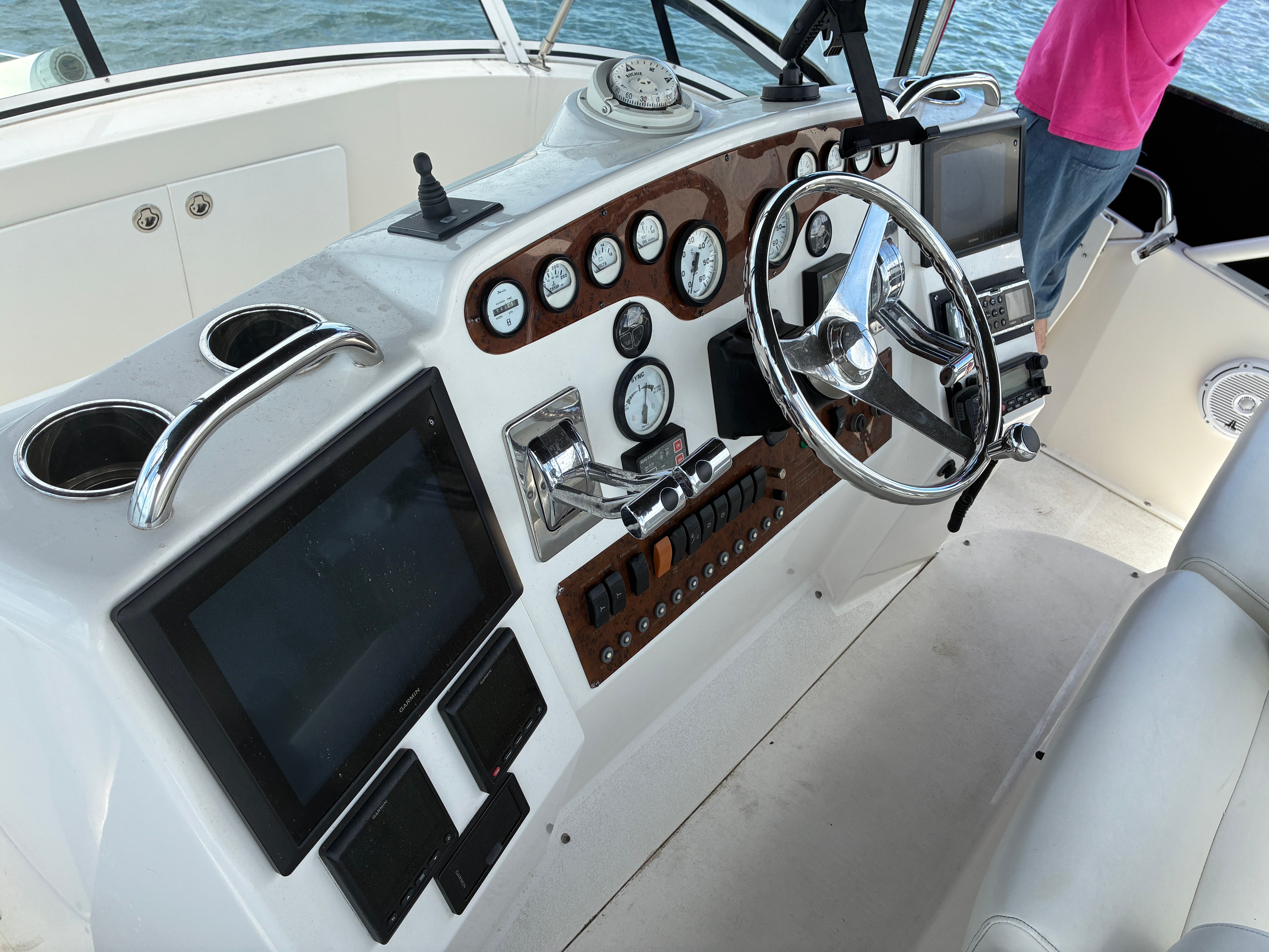 The image shows the helm of a 2001 Silverton 392 Motor Yacht with various instruments.