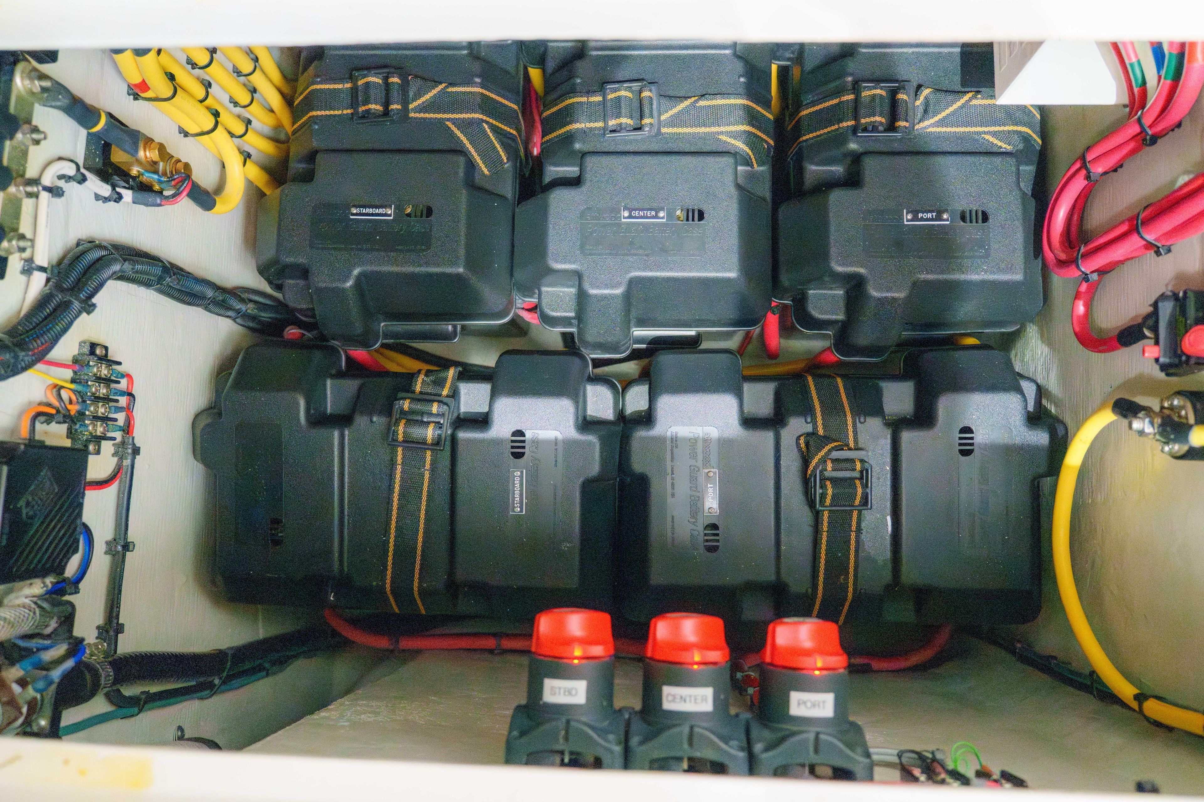 2022 SeaVee 370Z battery compartment with organized wiring and labeled switches.