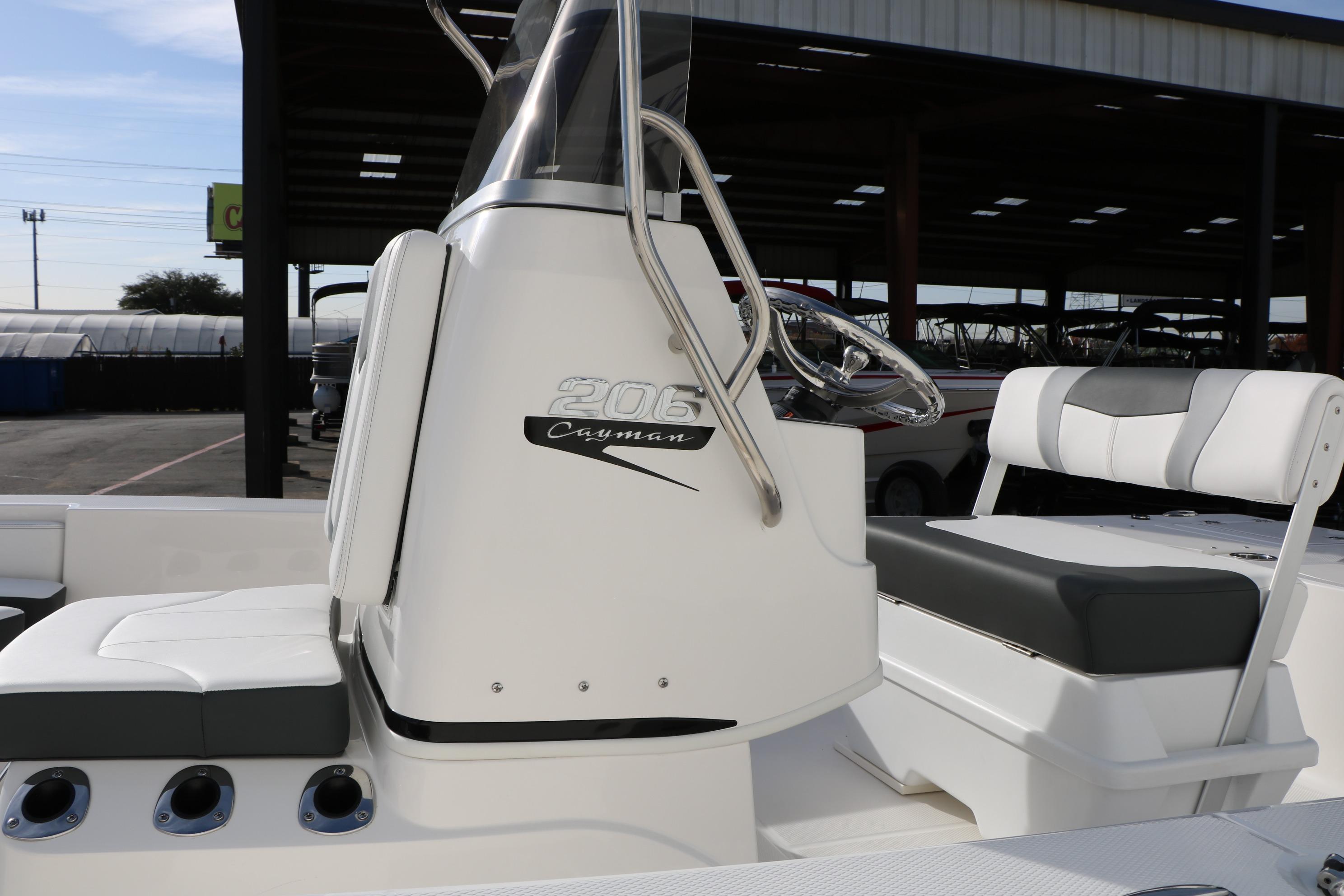 2026 Robalo 206 Cayman boat interior with steering console and seating.