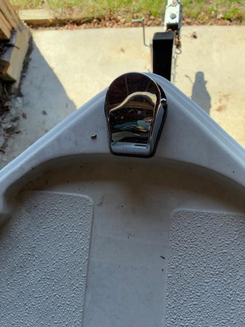 Bow of a 1990 Custom North End Composites Point boat with a metal cleat.
