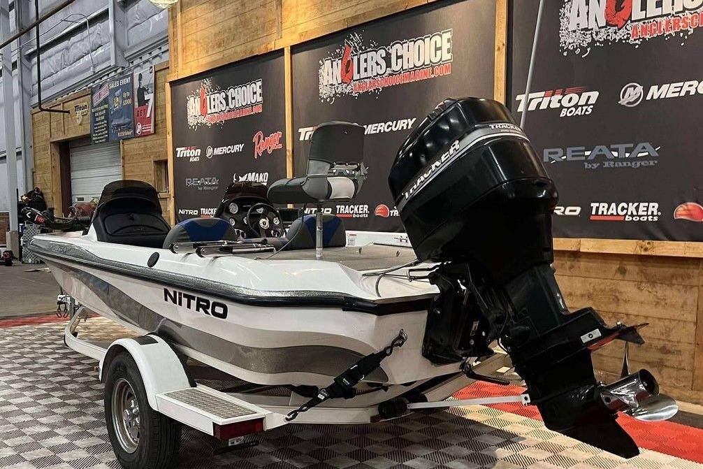 2005 Nitro NX 750 boat on display with Tracker outboard motor in showroom.