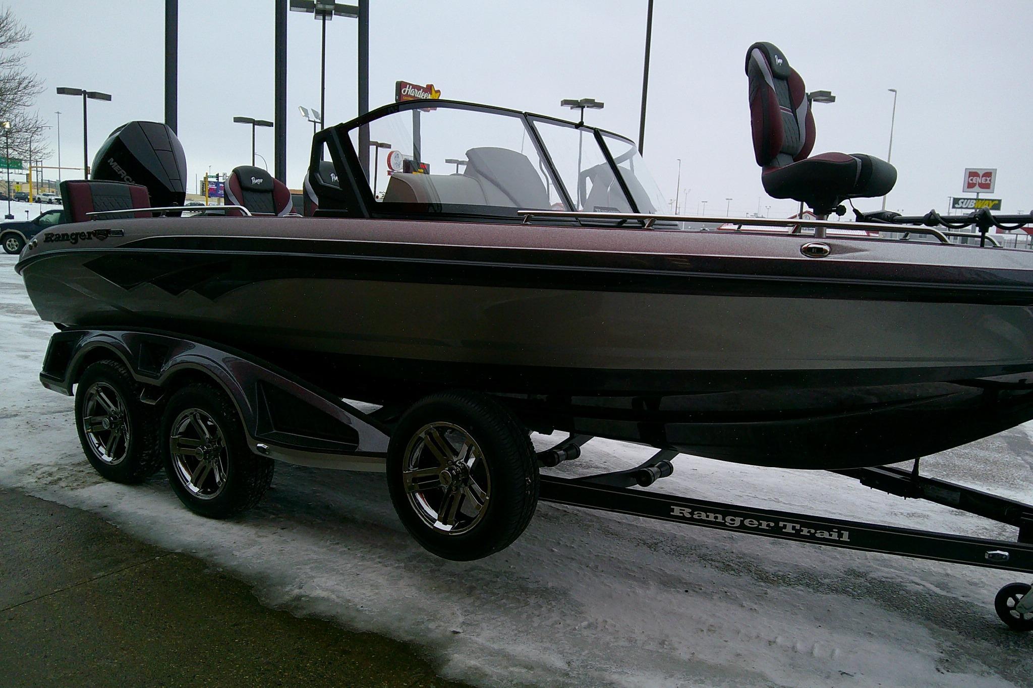 2026 Ranger 620xFS Pro boat on trailer, parked on snowy pavement.