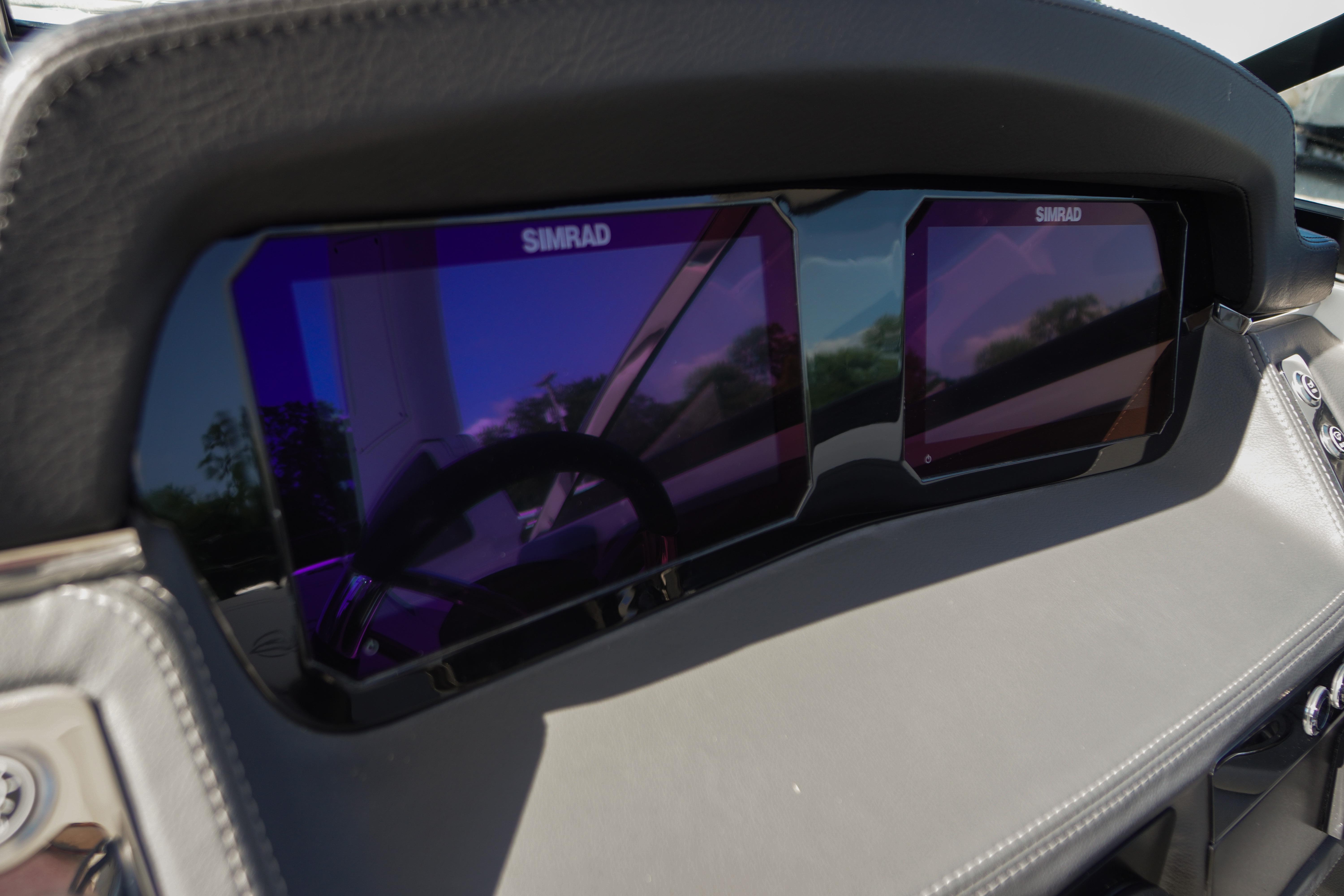 Dashboard of 2026 Chaparral 270 OSX featuring dual Simrad displays.