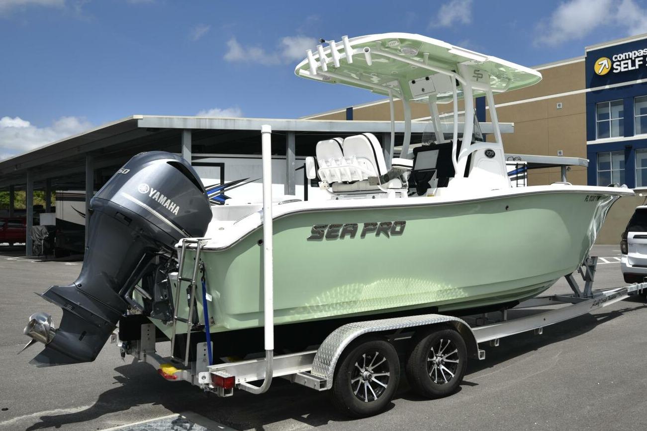 2023 Sea Pro 239 Deep V CC boat on trailer with Yamaha outboard motor.