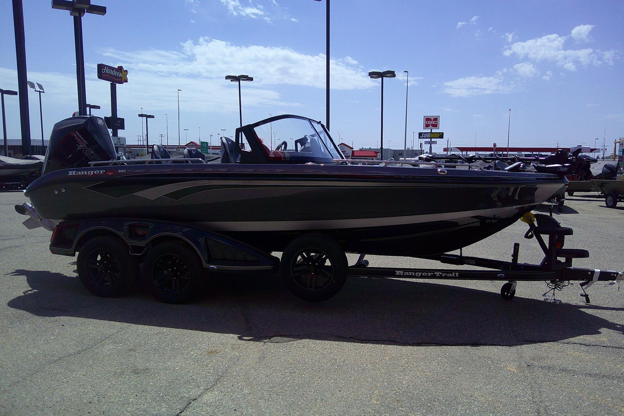 2026 Ranger 620FS Cup-Equipped boat on trailer in parking lot.