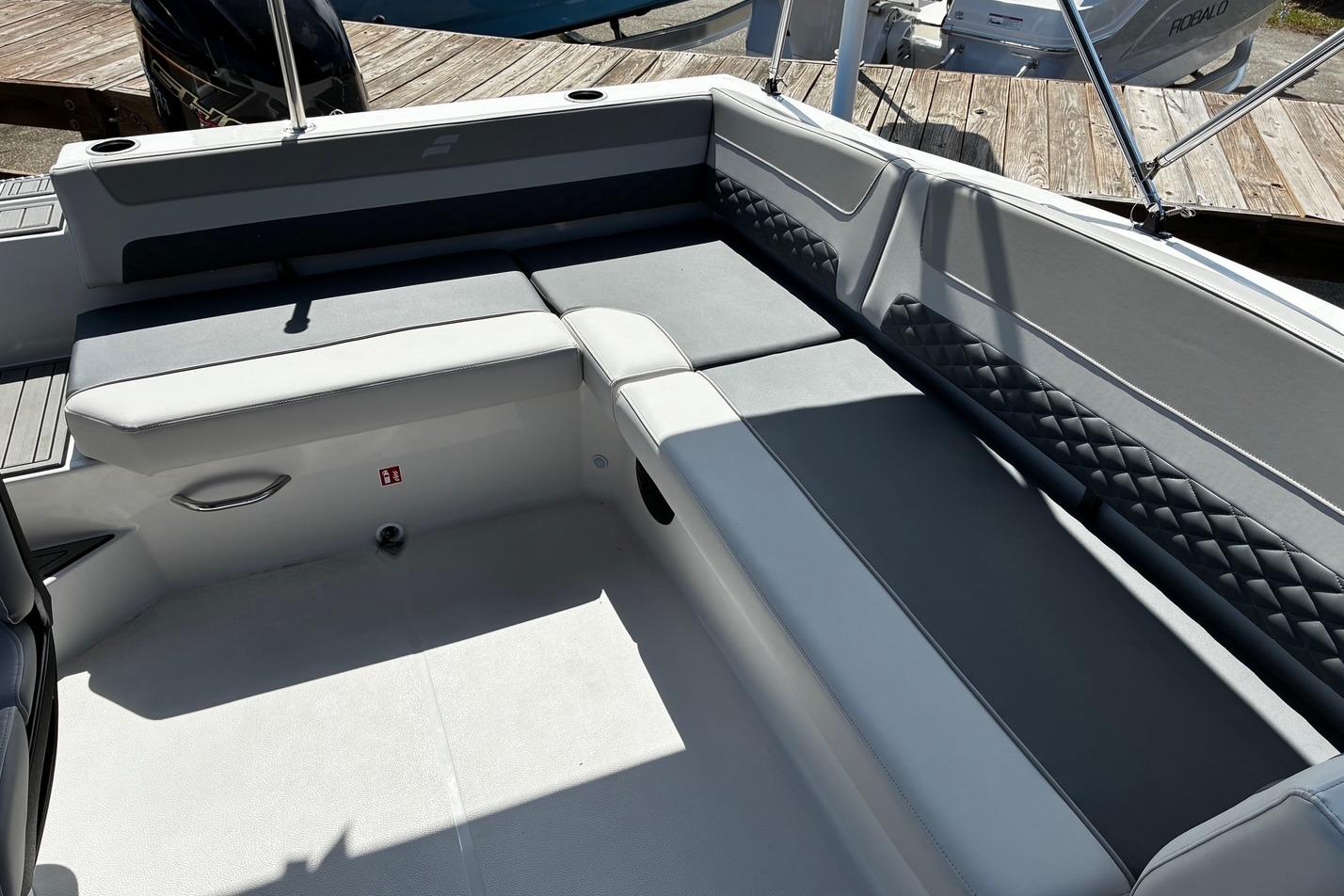 2026 Starcraft SVX 191 OB boat interior with gray cushioned seating and diamond-patterned accents.