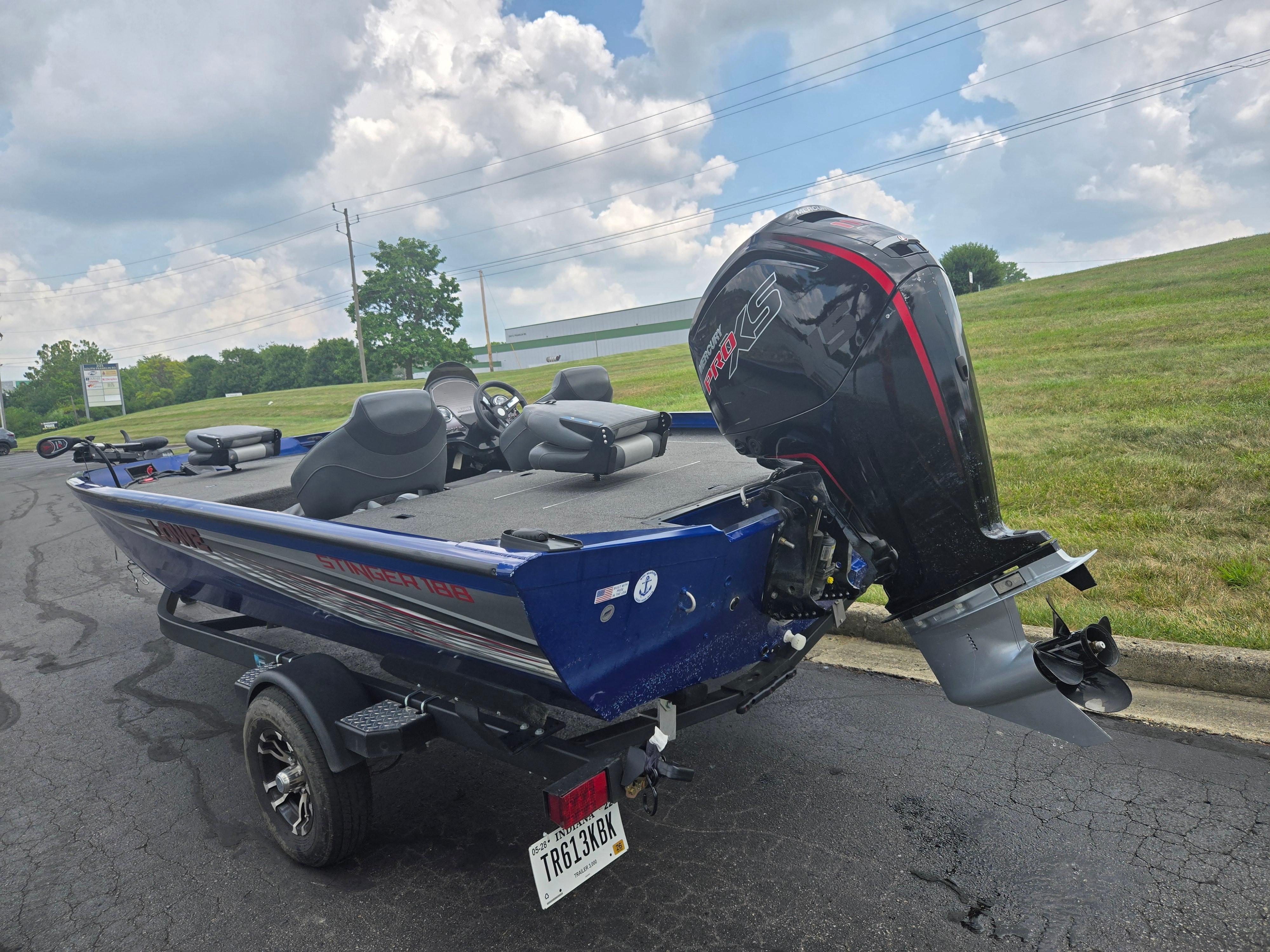 2021 Lowe Stinger 188 boat with powerful outboard motor on a trailer.