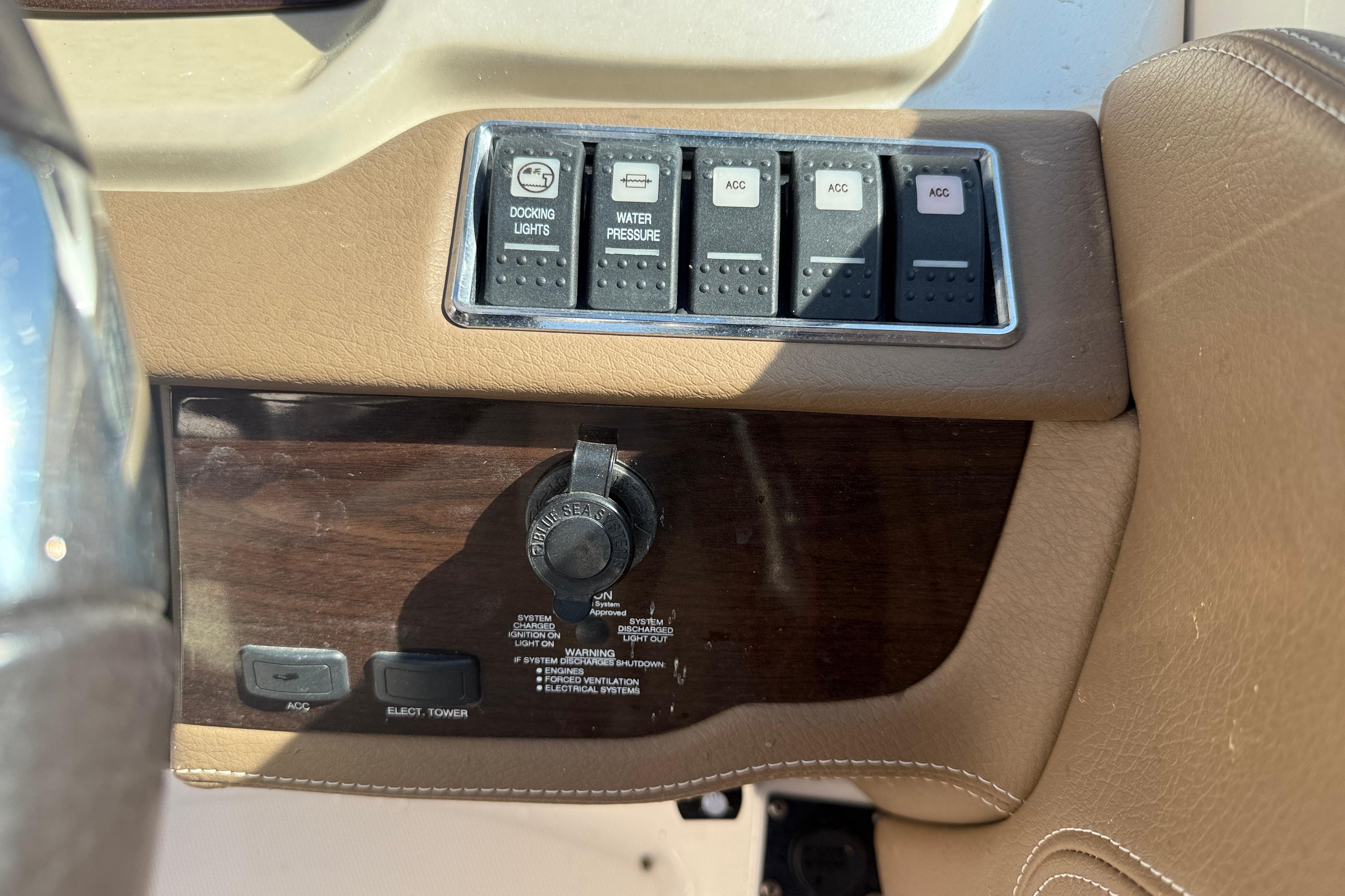 Control panel of a 2014 Chaparral 264 Sunesta boat with switches and ignition.