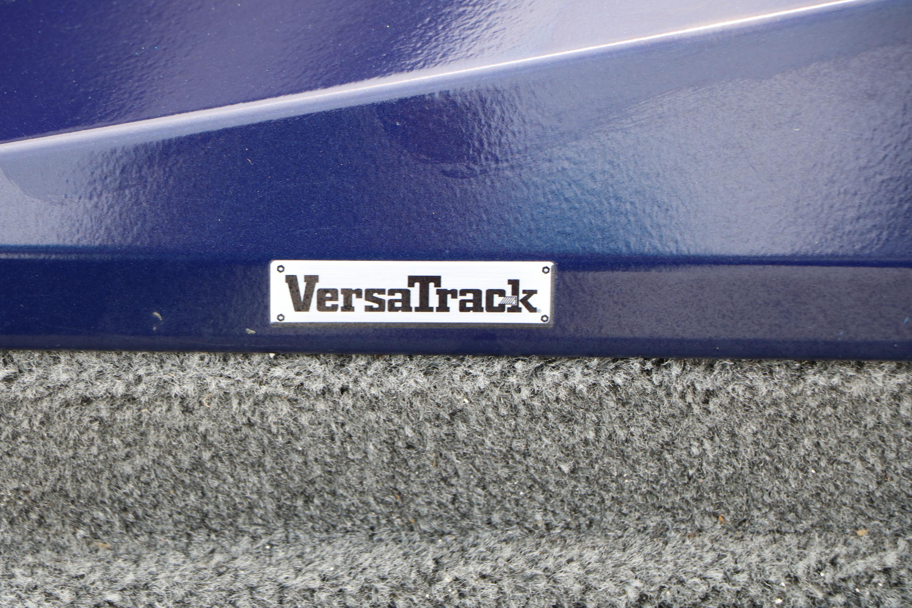 VersaTrack label on 2022 Tracker Pro Team 175 TF boat, blue and gray surface.