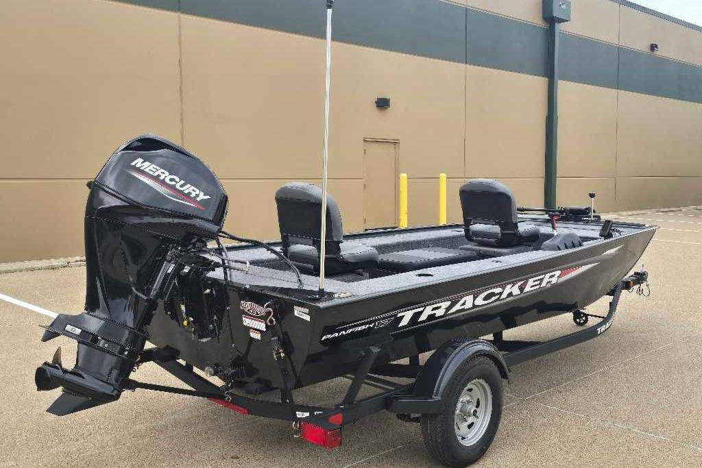 2026 Tracker Panfish 17 boat with Mercury engine on trailer, parked outdoors.