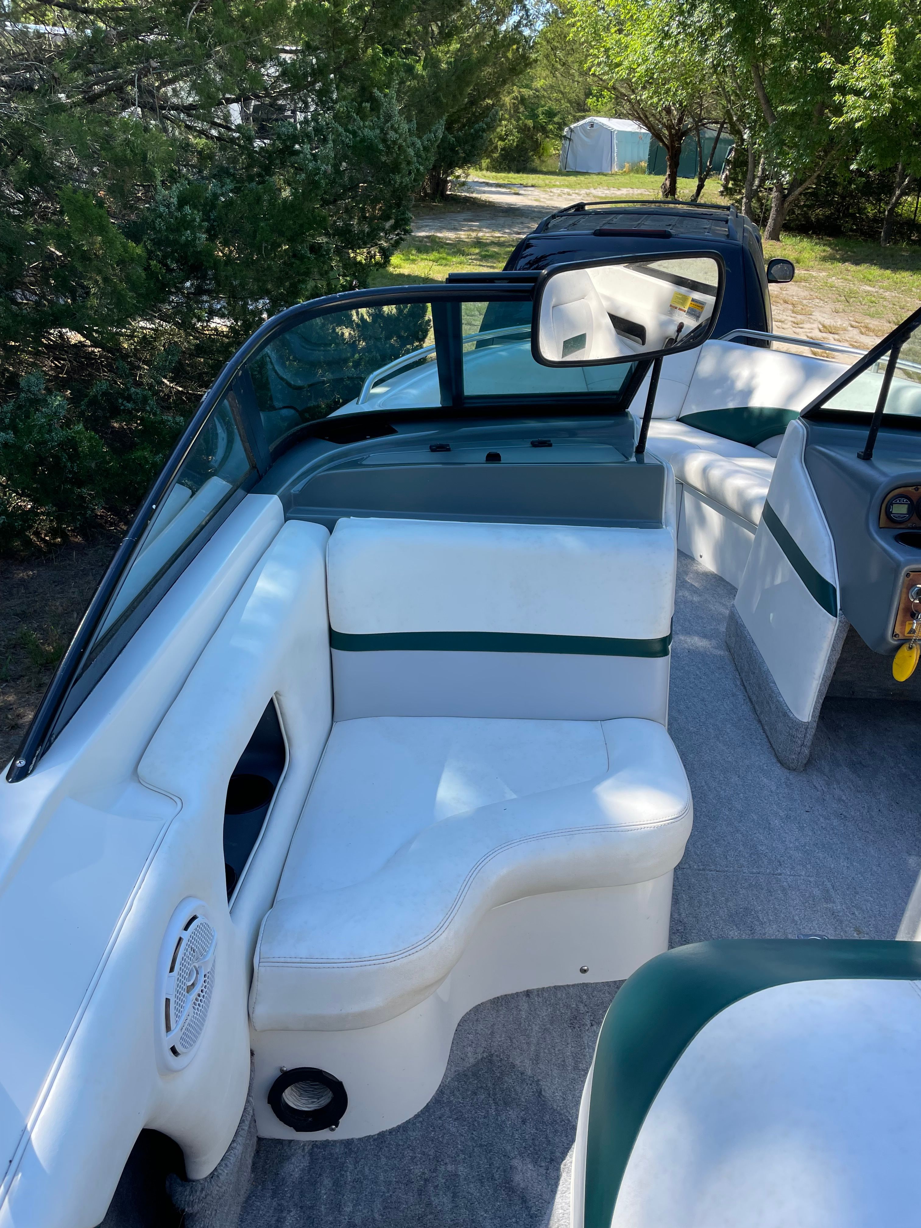 Interior of a 1997 MasterCraft Prostar 205 boat with white seating.