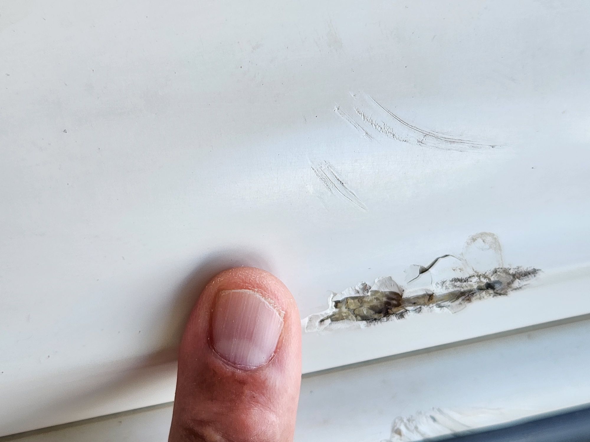 Close-up of damage on a 2004 Sea Ray 185 boat.