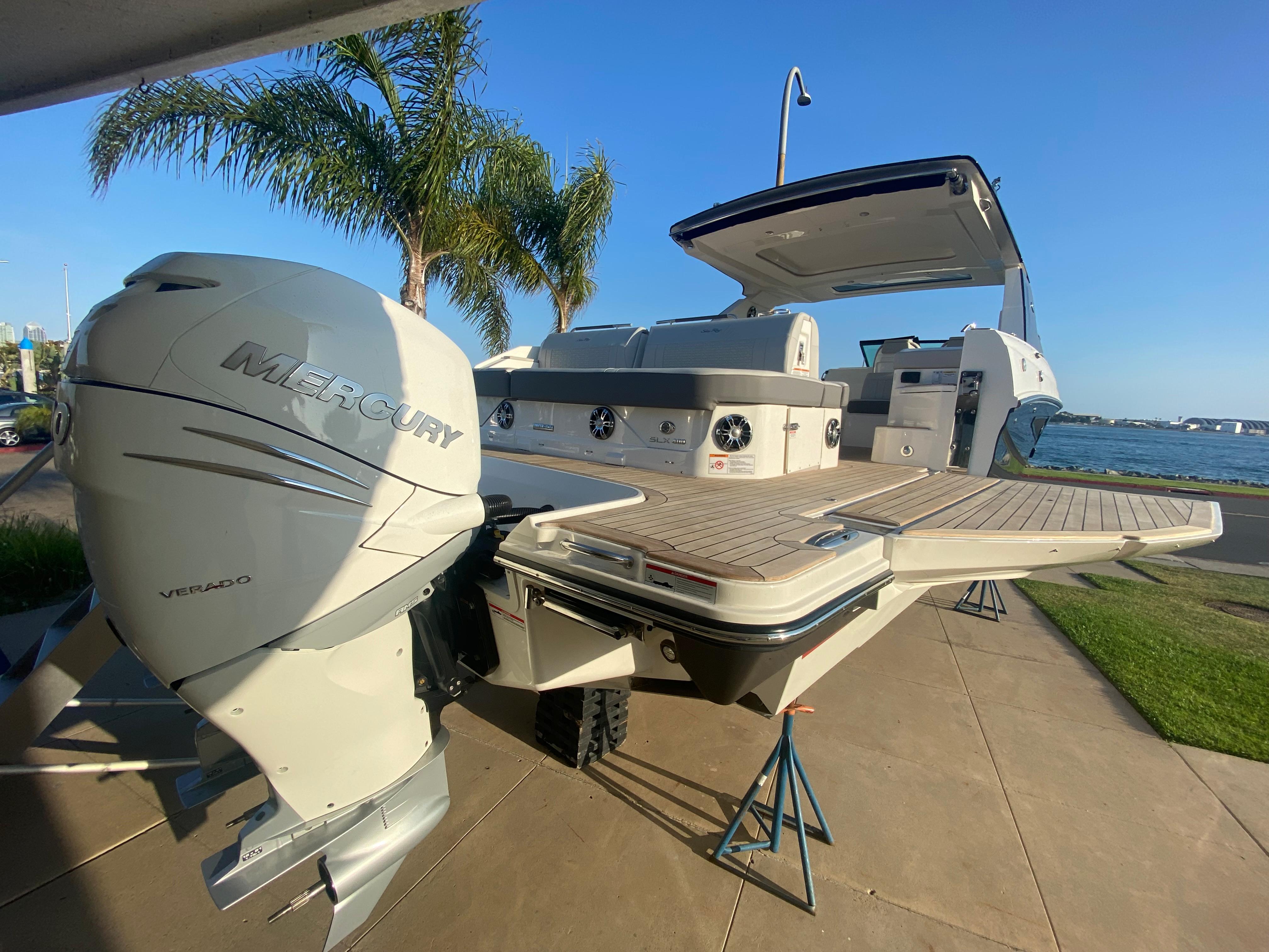 2021 Sea Ray SLX 400 Outboard with Mercury engine by the water.